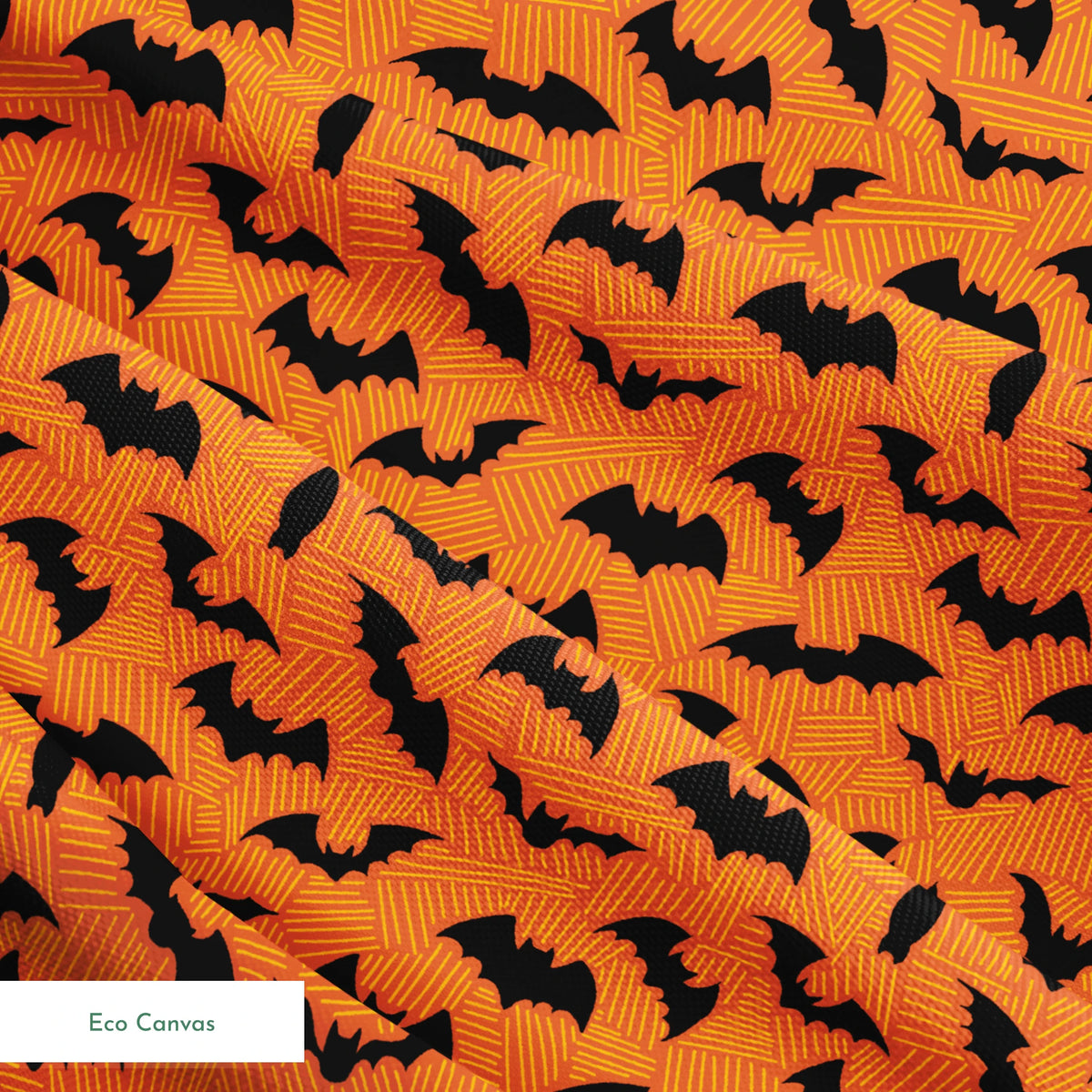Halloween pattern with black bats scattered across an orange textured background springs ecocanvas texture