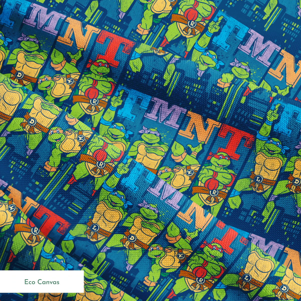 Colorful Teenage Mutant Ninja Turtles cartoon pattern with characters and "TMNT" text on blue cityscape background springs ecocanvas texture