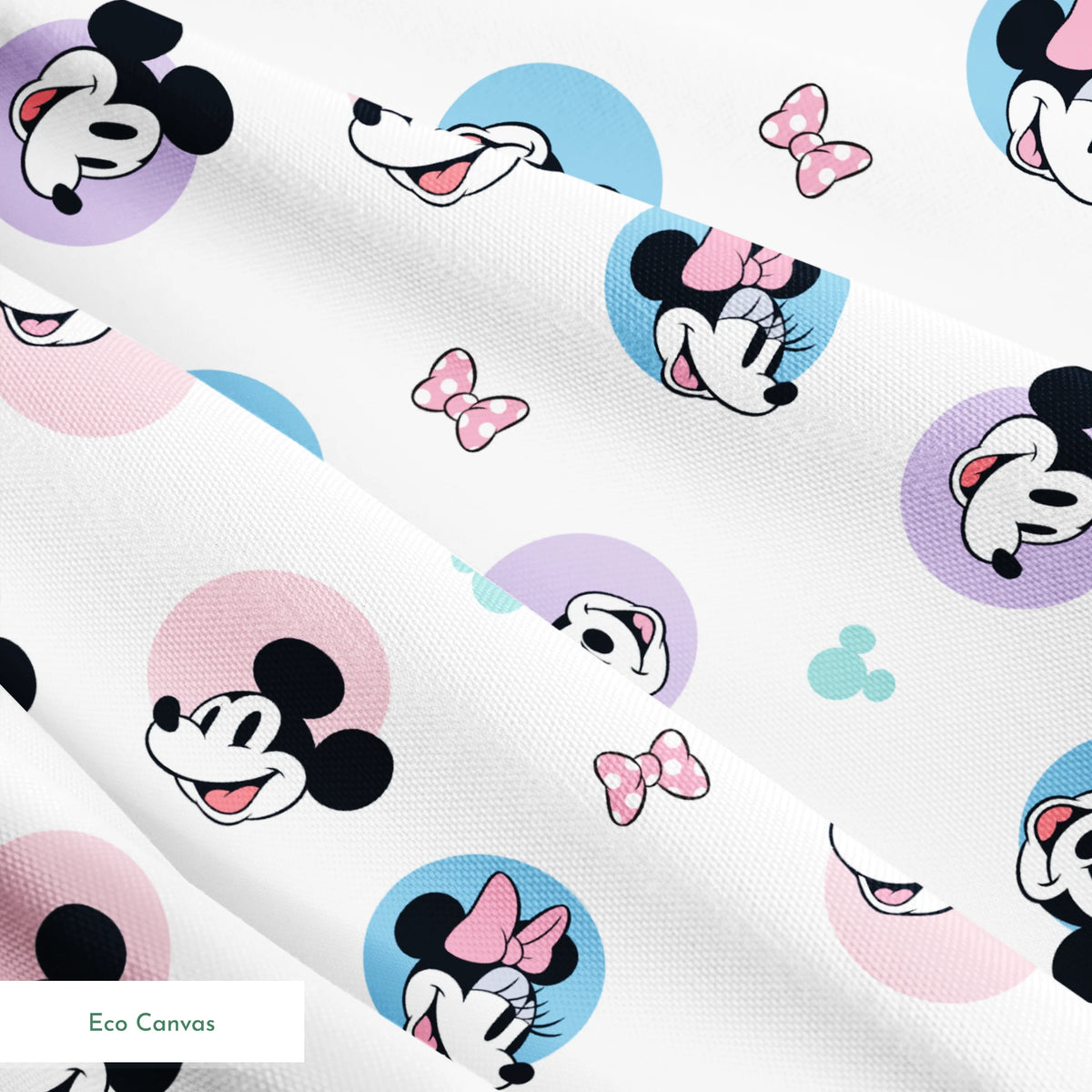 Disney Mickey and Minnie Mouse pattern with character heads on pastel circles, pink bows, and small Mickey icons springs ecocanvas texture