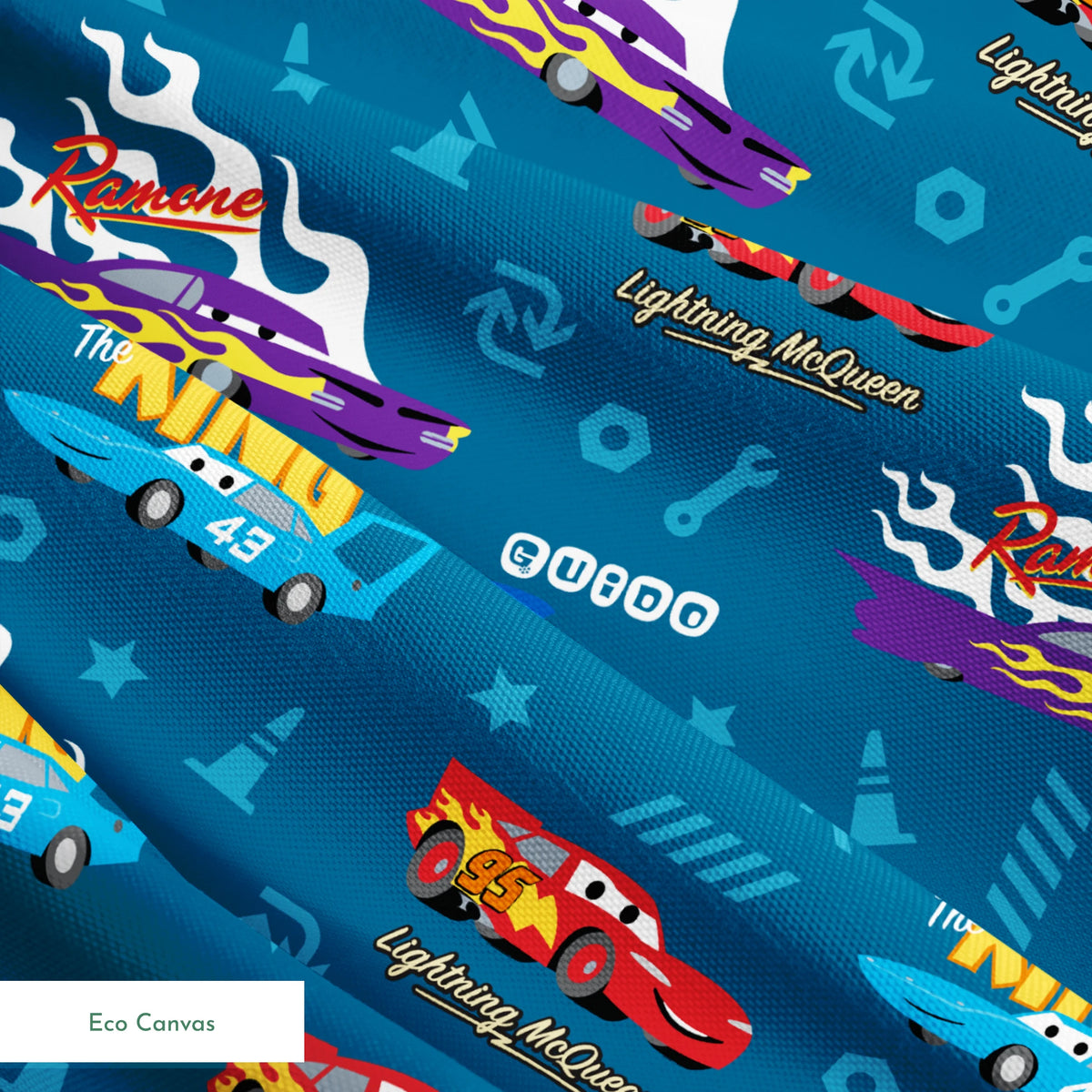 Disney Cars pattern featuring Lightning McQueen, Ramone's purple car with flames, and The King 43 on blue background with racing icons springs ecocanvas texture