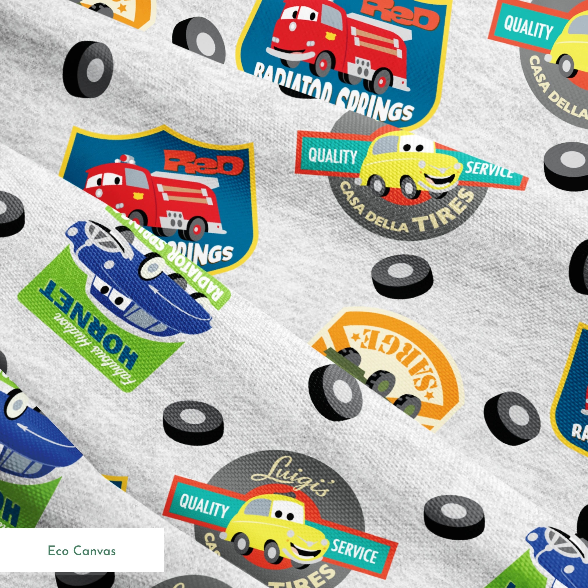 Cartoon vehicle characters on gray fabric with badges for Radiator Springs, Luigi's, and Sarge's springs ecocanvas texture