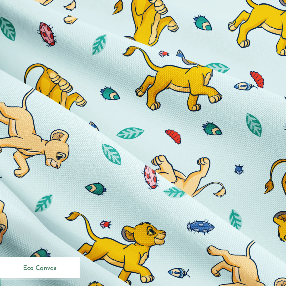Lion cubs playing on light blue background with colorful leaves and plant elements scattered throughout springs ecocanvas texture