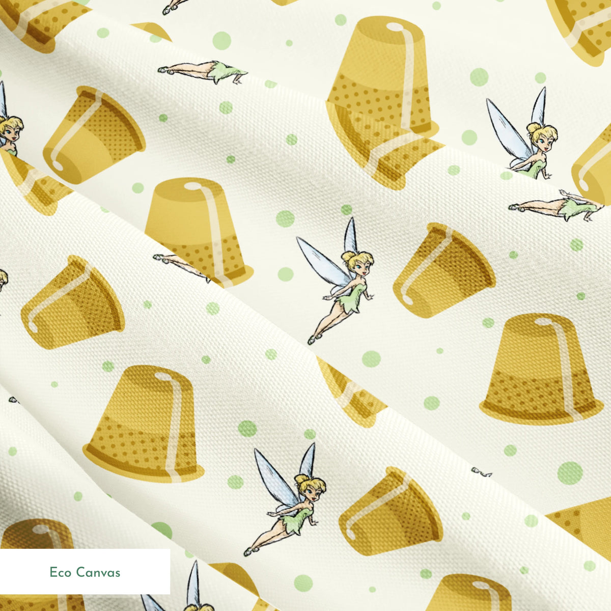 A pattern featuring Tinkerbell fairy with golden thimbles on a pale background with green dots. springs ecocanvas texture