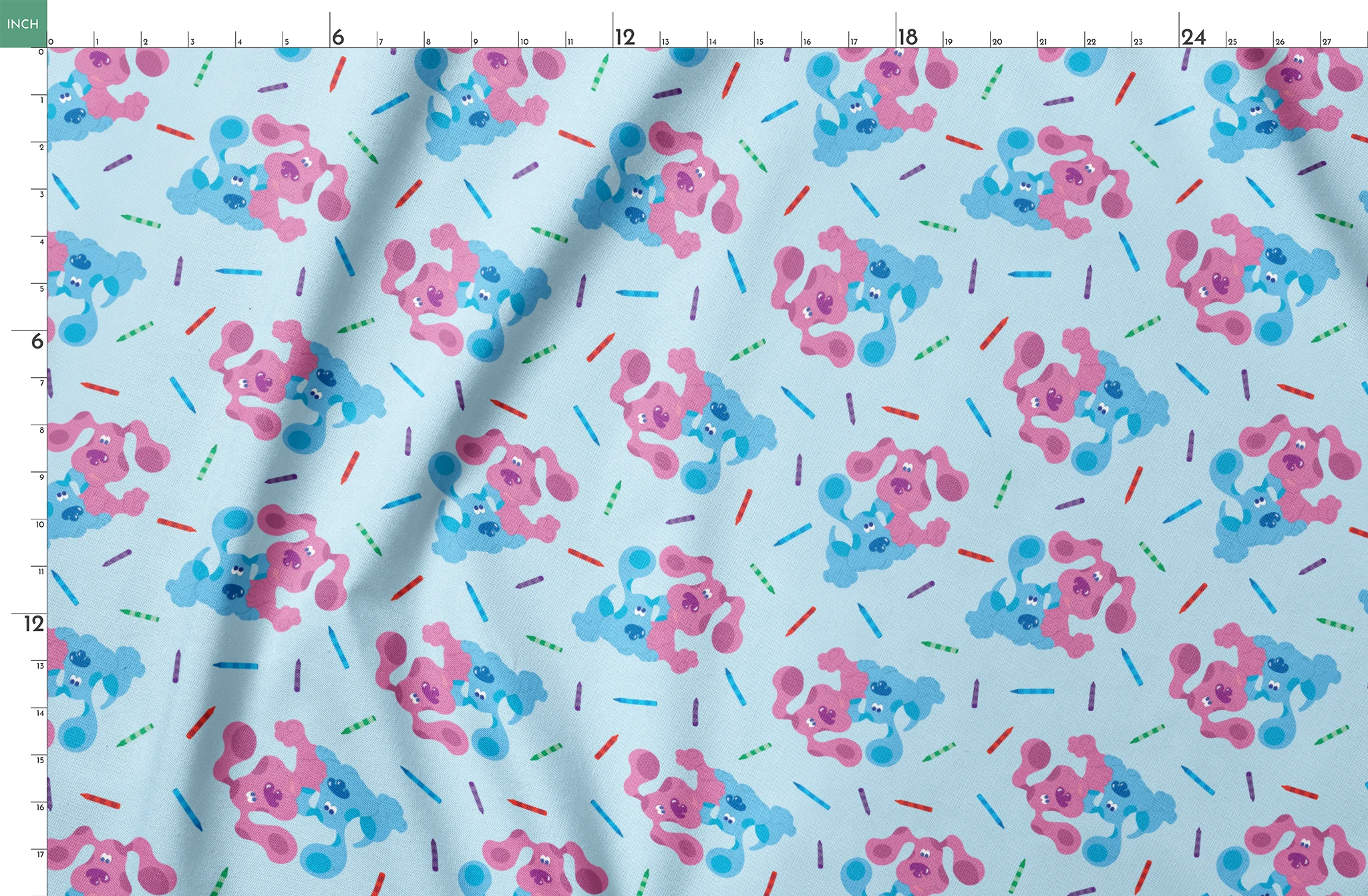 Playful pattern of cartoon blue and pink dogs with colorful stick accents on light blue background springs fatquarter mockup