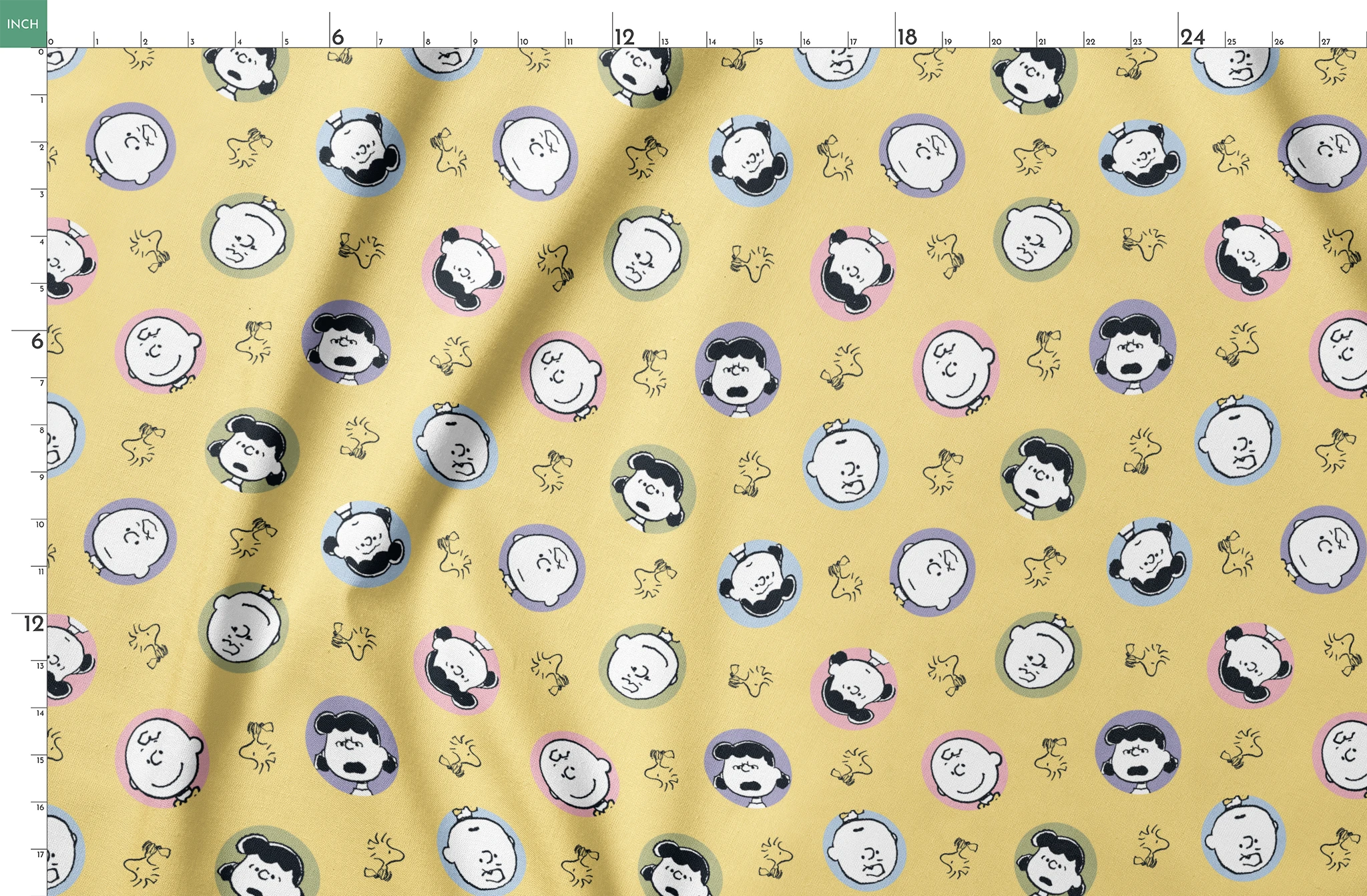 Peanuts characters pattern with Charlie Brown and friends in circular frames on yellow background with Woodstock silhouettes springs fatquarter mockup