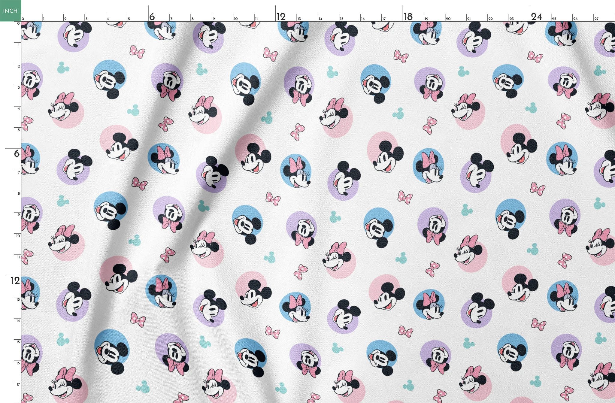 Disney Mickey and Minnie Mouse pattern with character heads on pastel circles, pink bows, and small Mickey icons springs fatquarter mockup