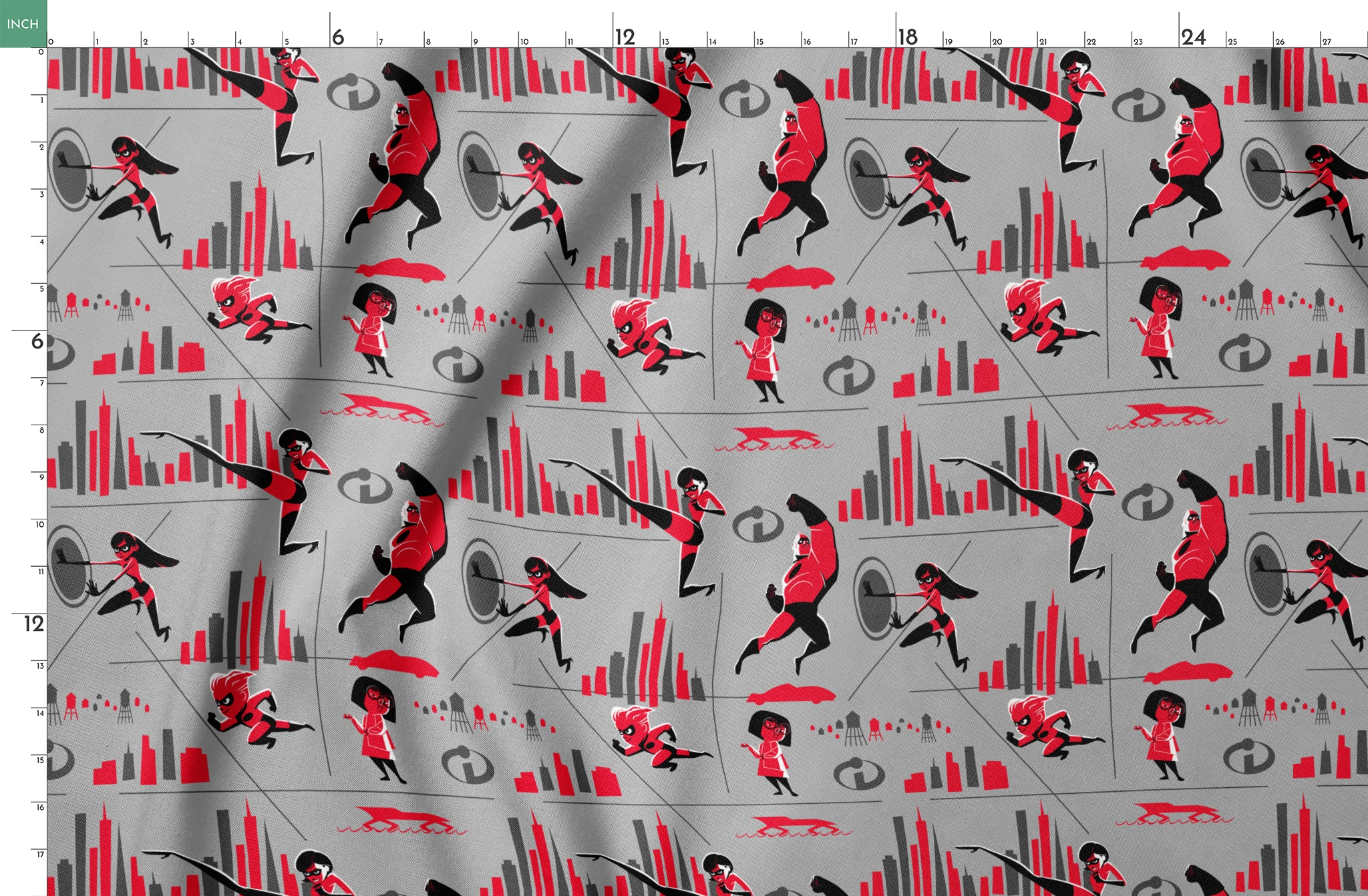 Characters in red and black superhero outfits from The Incredibles shown in action poses against gray background with city elements springs fatquarter mockup