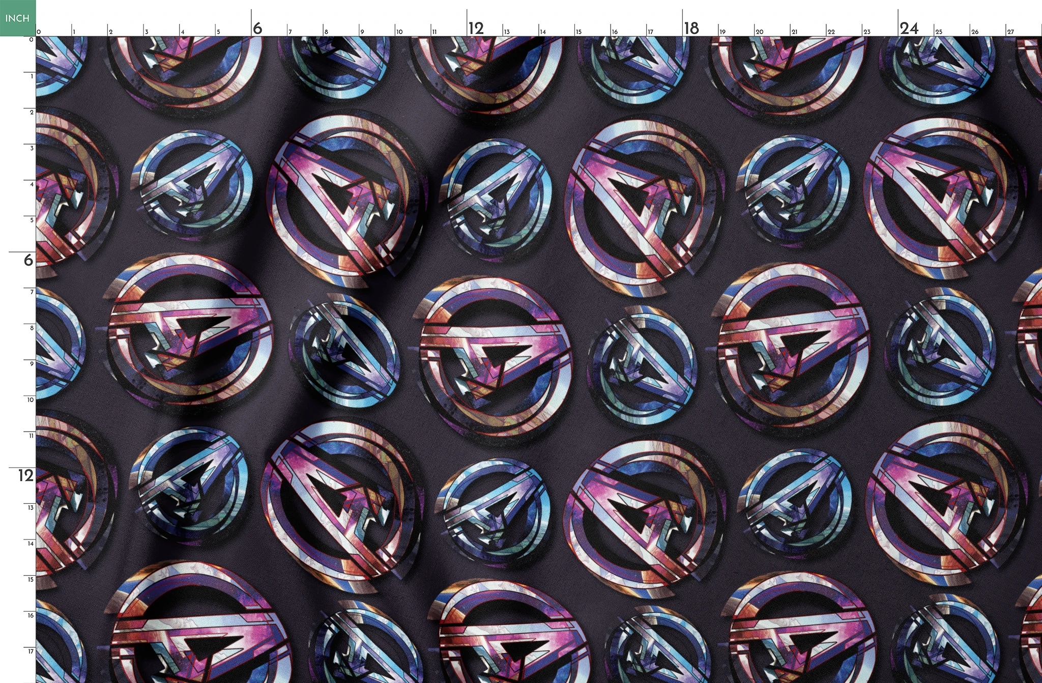 Colorful metallic Avengers logo pattern with iridescent purple and blue reflections on dark background springs fatquarter mockup