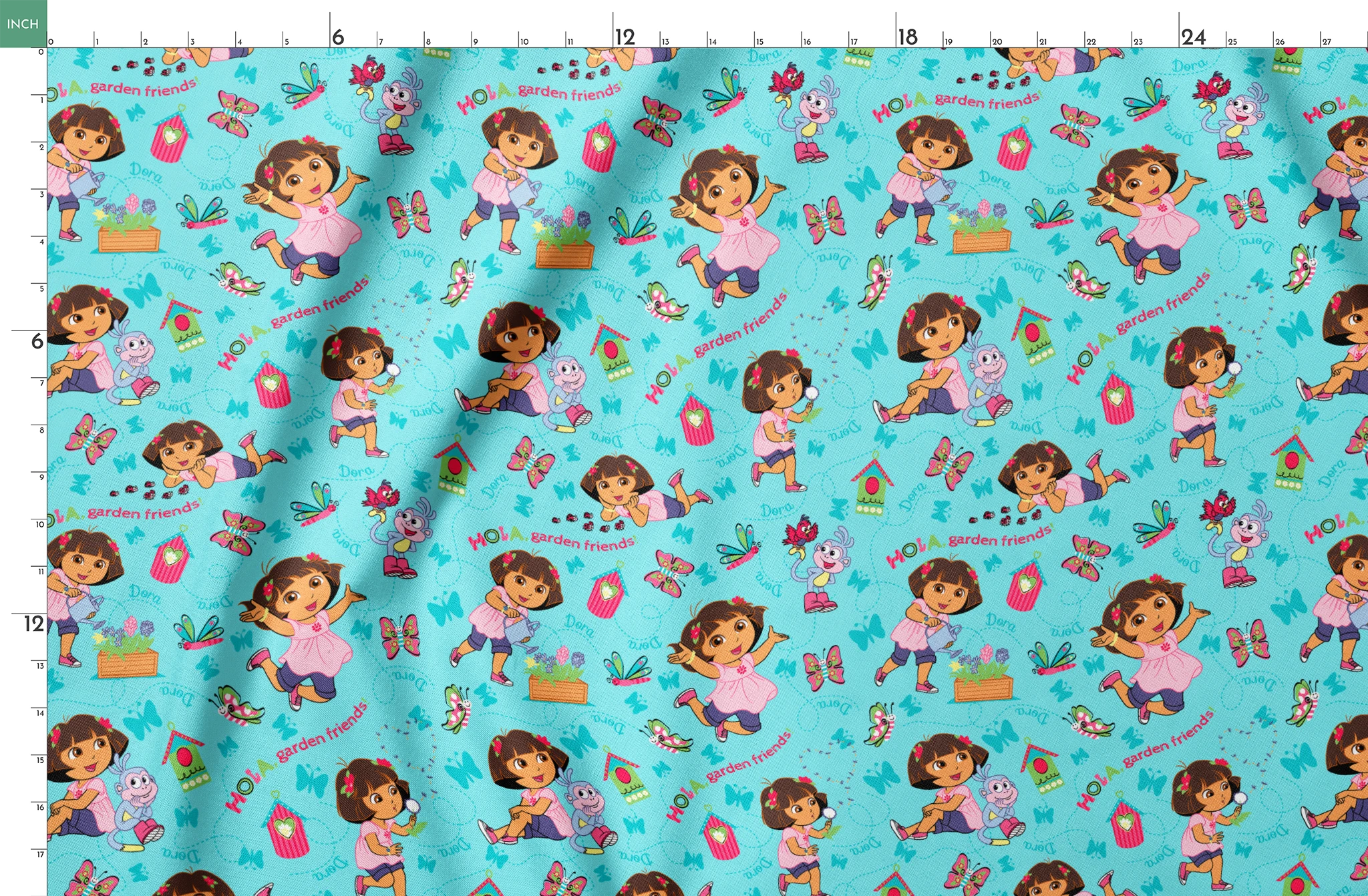 Colorful Dora the Explorer pattern on light blue background springs fatquarter mockup