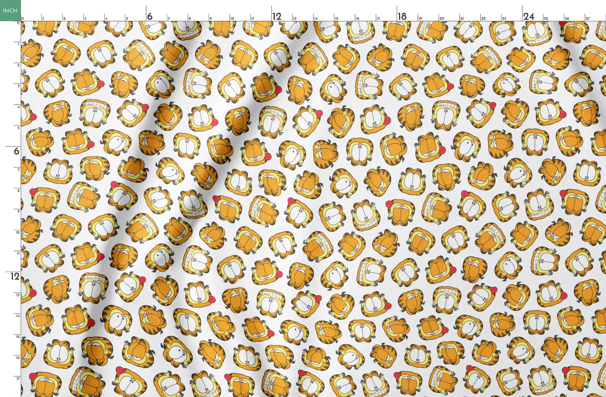 Pattern of cartoon cat faces with orange and yellow coloring against white background springs fatquarter mockup