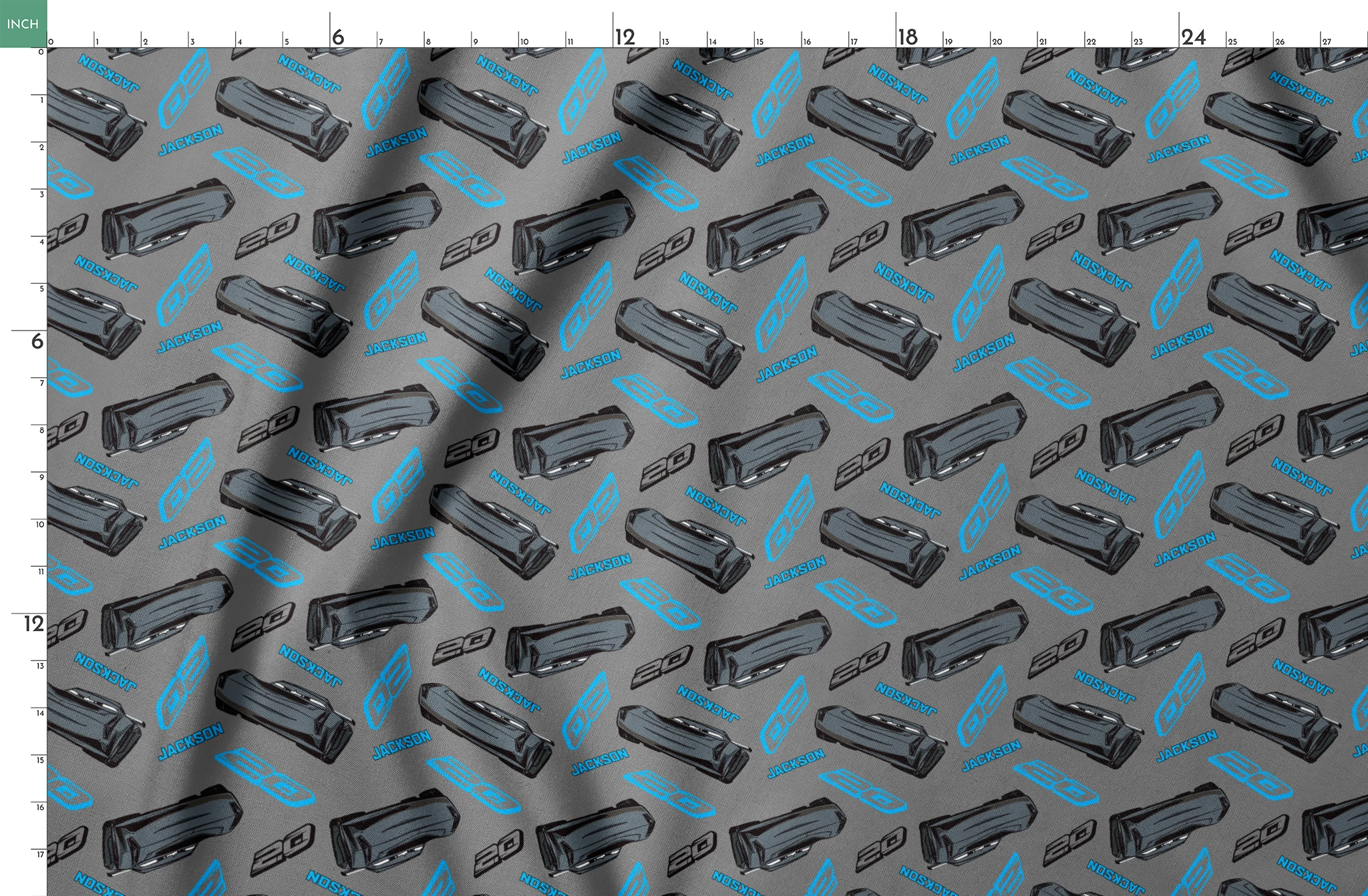 Dark gray background with scattered black car parts and blue "JACKSON" text and stylized logos in a repeating pattern springs fatquarter mockup
