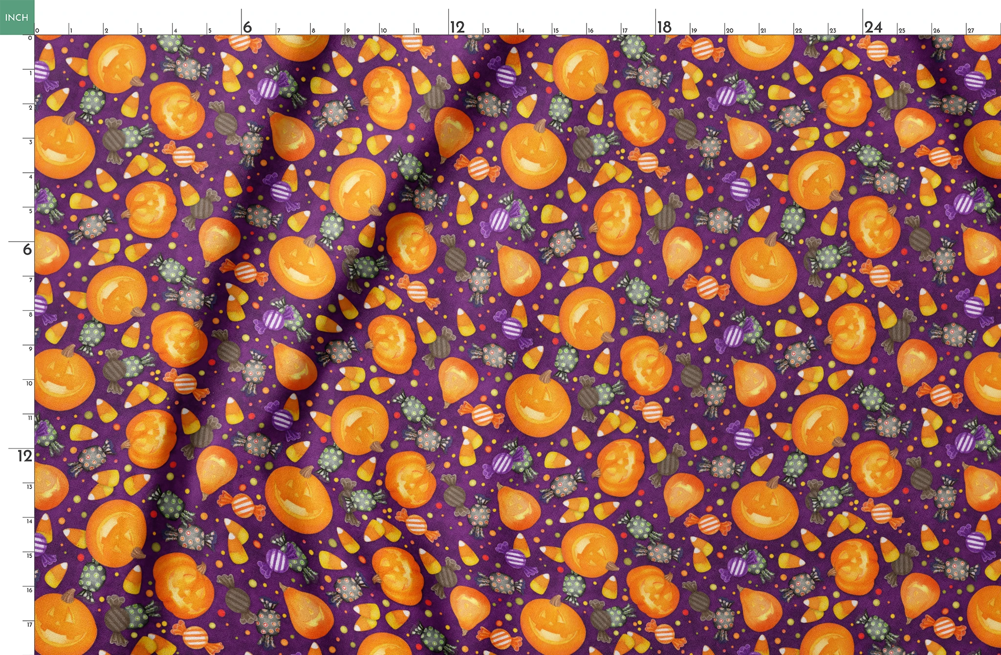 Playful Halloween fabric design by Nicole Tamarin featuring smiling jack-o’-lanterns, wrapped candies, and candy corn scattered across a purple background. springs fatquarter mockup