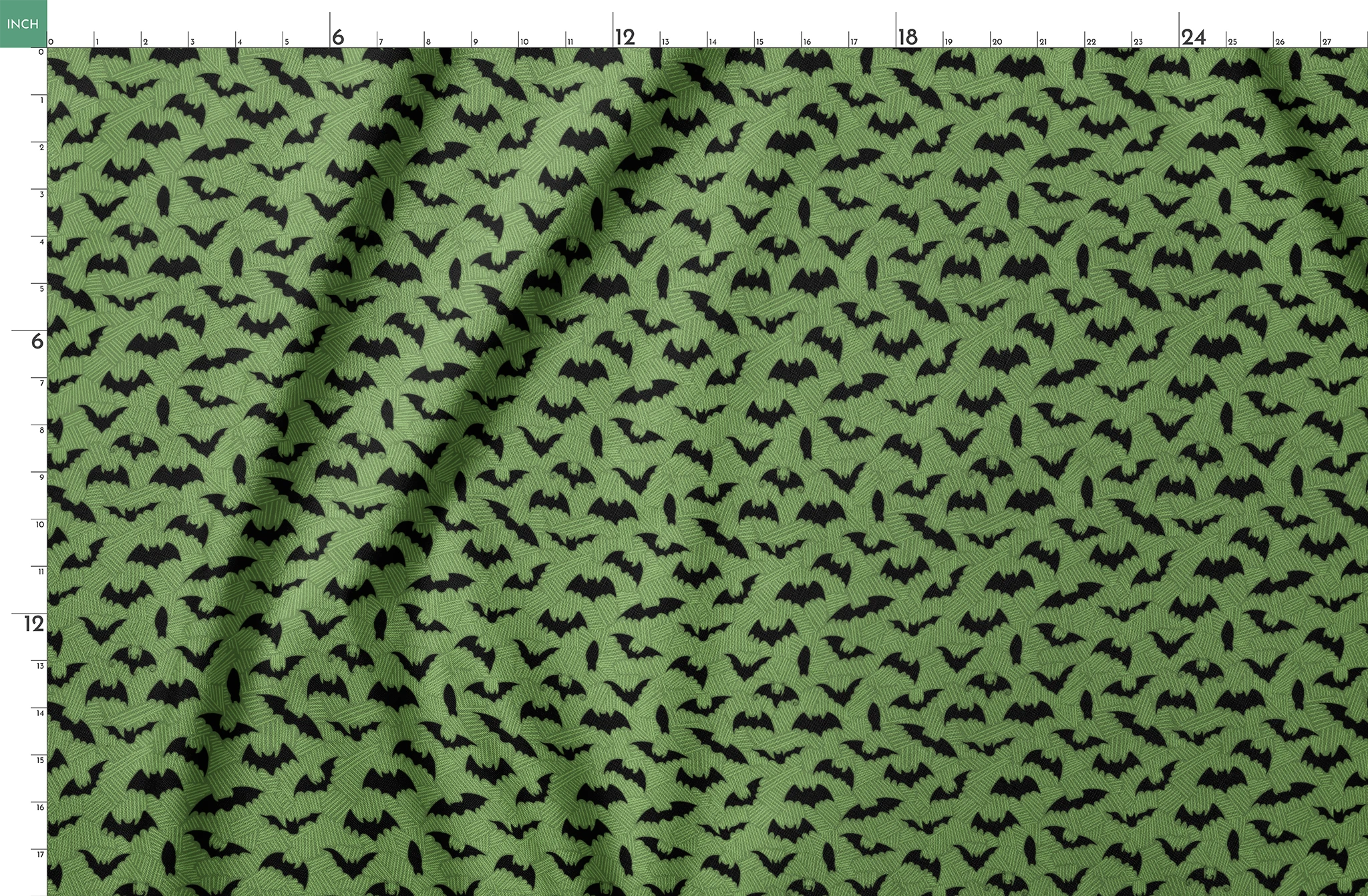 Black bat silhouettes scattered across a green textured background with zigzag pattern springs fatquarter mockup