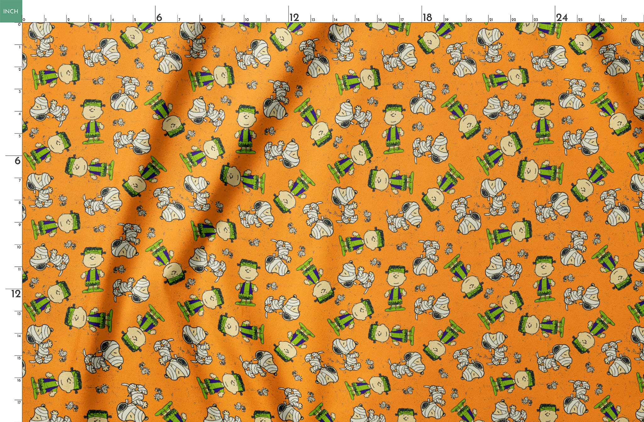 Peanuts characters pattern on orange background with Charlie Brown, Snoopy, and friends scattered throughout springs fatquarter mockup