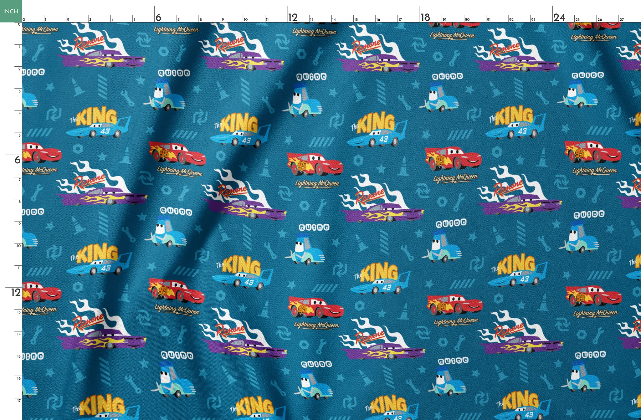 Disney Cars pattern featuring Lightning McQueen, Ramone's purple car with flames, and The King 43 on blue background with racing icons springs fatquarter mockup