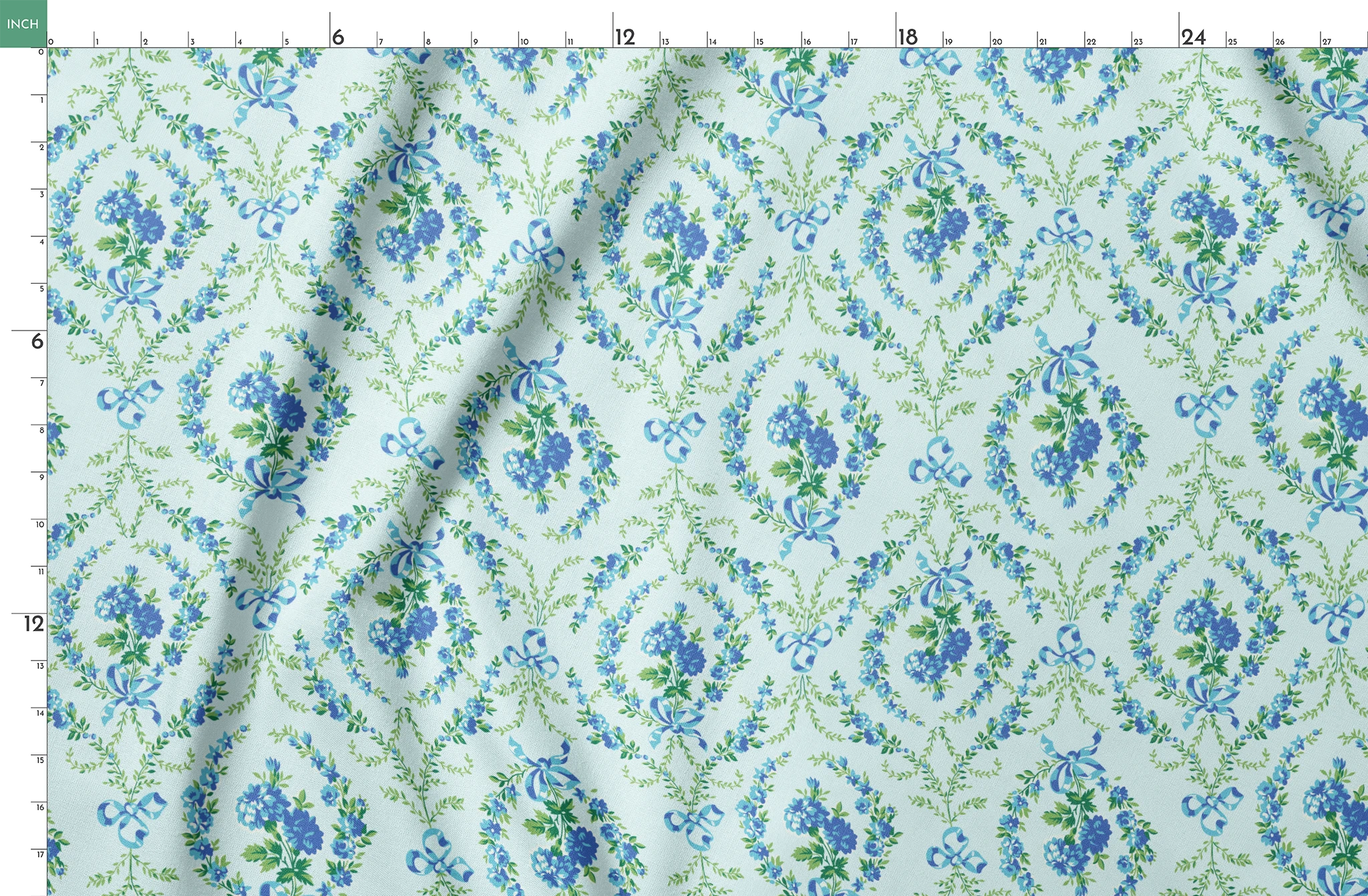 Blue floral pattern with diamond lattice design featuring delicate ribbons and green foliage on light background springs fatquarter mockup