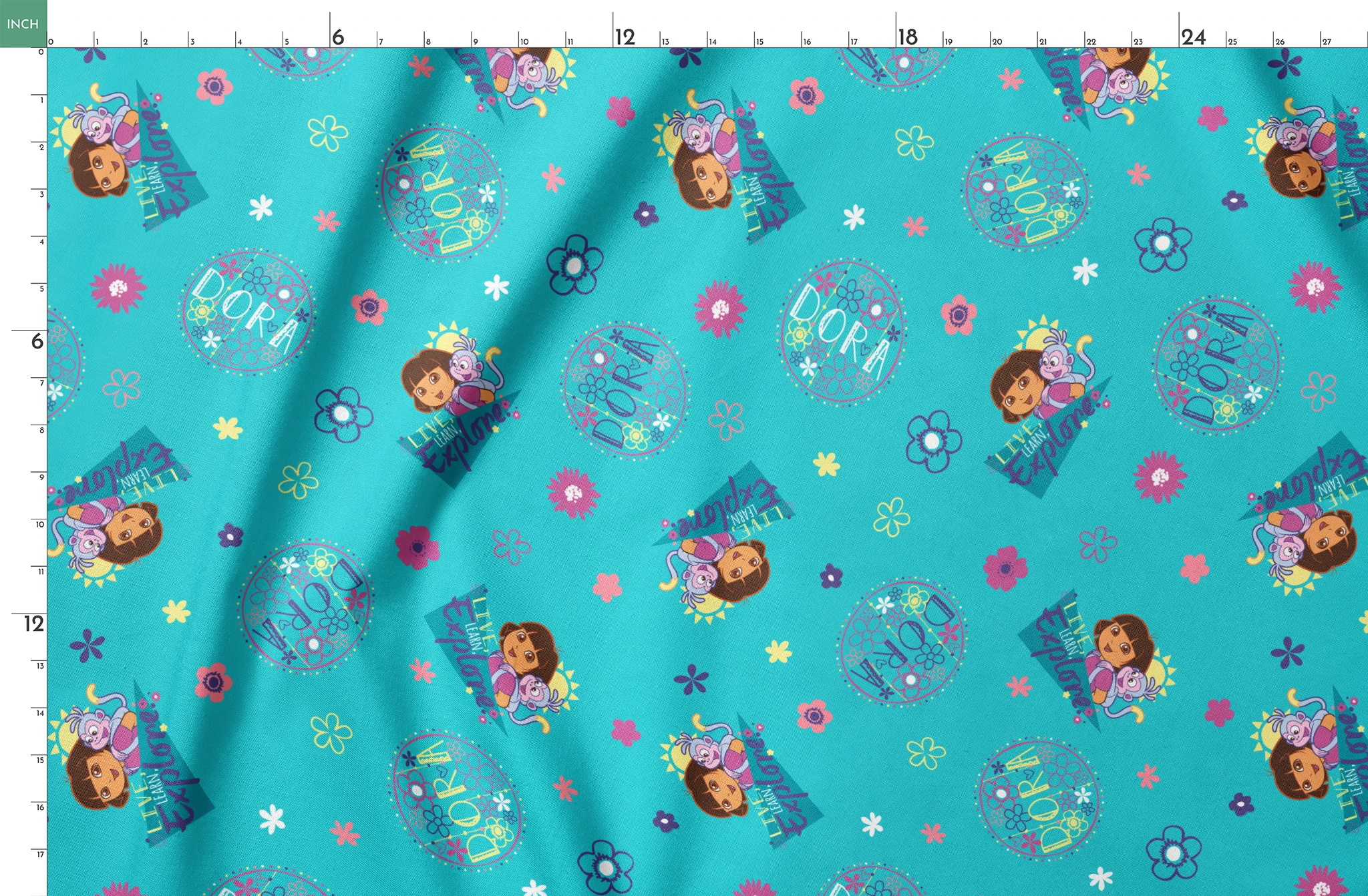 Colorful teal pattern with Dora the Explorer characters, decorative circles, flowers, and triangular shapes in pink, purple, and blue springs fatquarter mockup