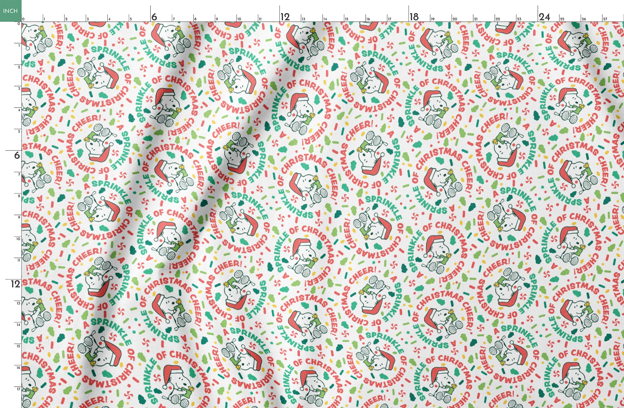 Holiday pattern with Snoopy wearing Santa hat, surrounded by "Merry Christmas", "Cheer", and candy designs on white background springs fatquarter mockup