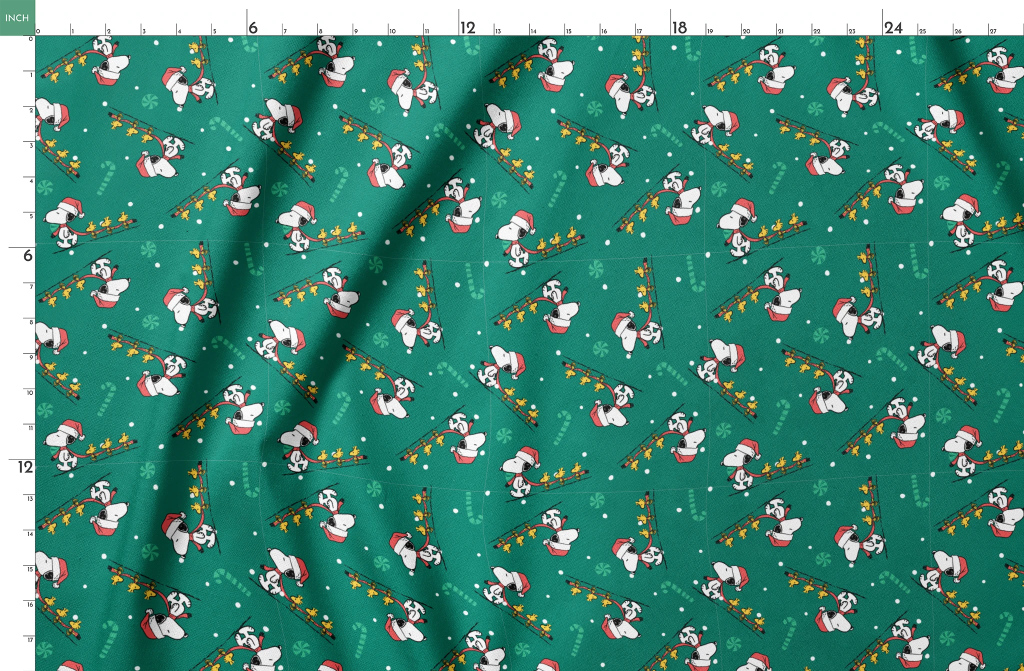 Holiday pattern with Snoopy in Santa hats pulling sleds of stars on green background with candy canes and snowflakes springs fatquarter mockup