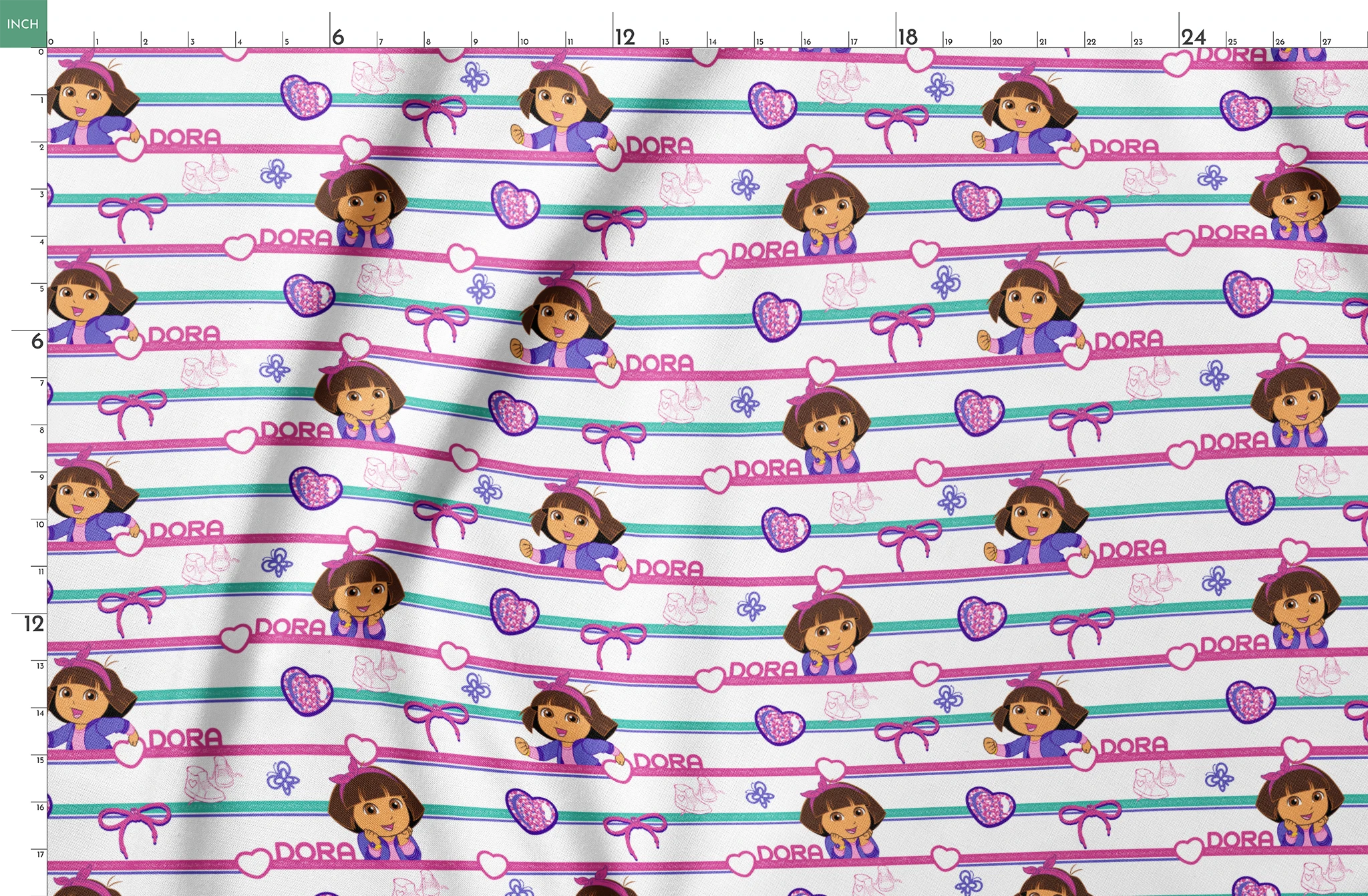 Colorful Dora the Explorer pattern with horizontal stripes featuring purple hearts, bows, butterflies, and "DORA" text on pink and green backgrounds springs fatquarter mockup