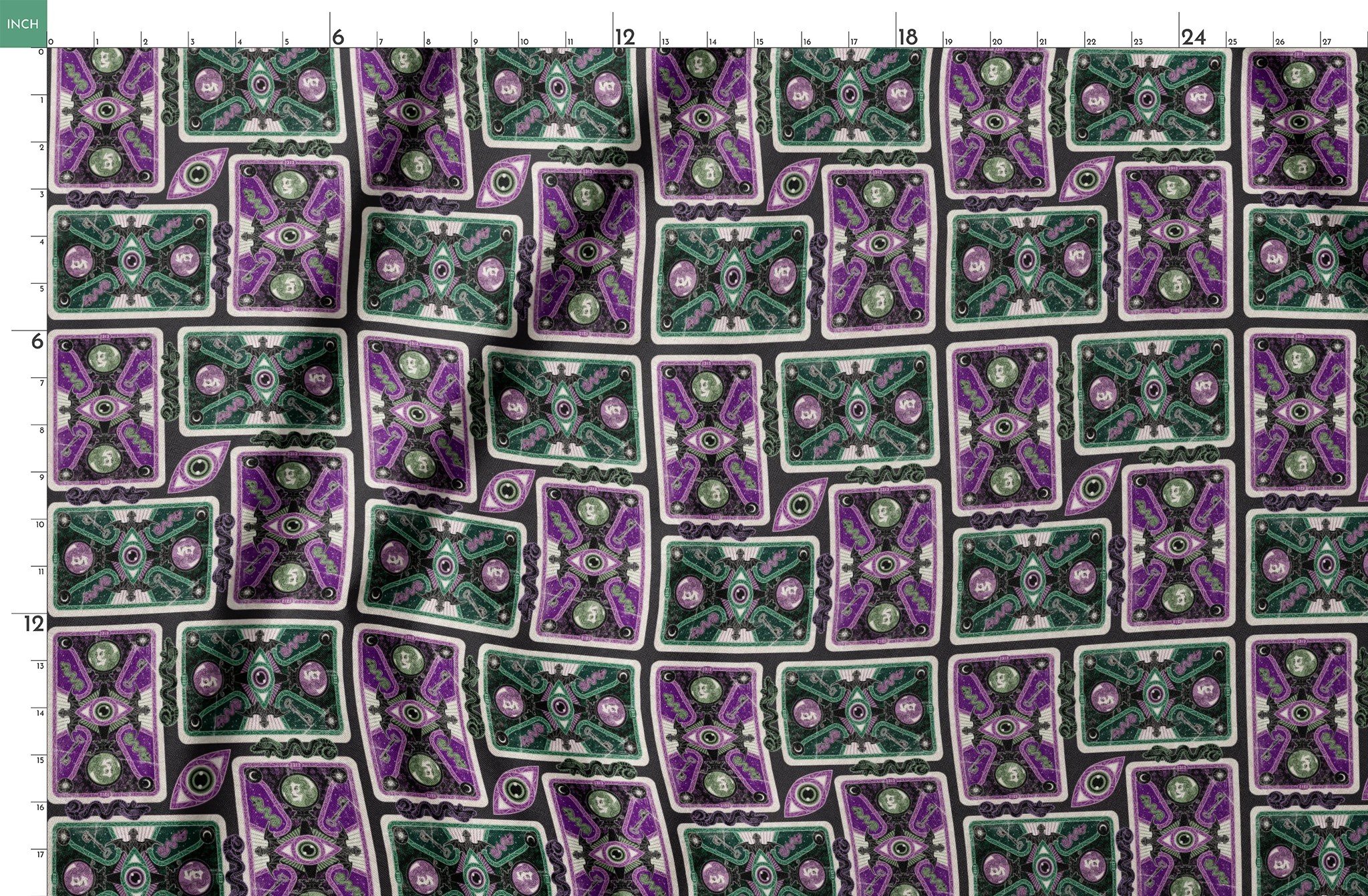 Ornate playing card designs with purple and green patterns featuring central eye motifs and circular number elements against a black background. springs fatquarter mockup