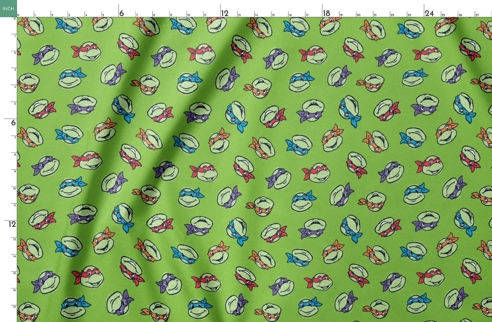 Teenage Mutant Ninja Turtles scattered on bright green background springs fatquarter mockup