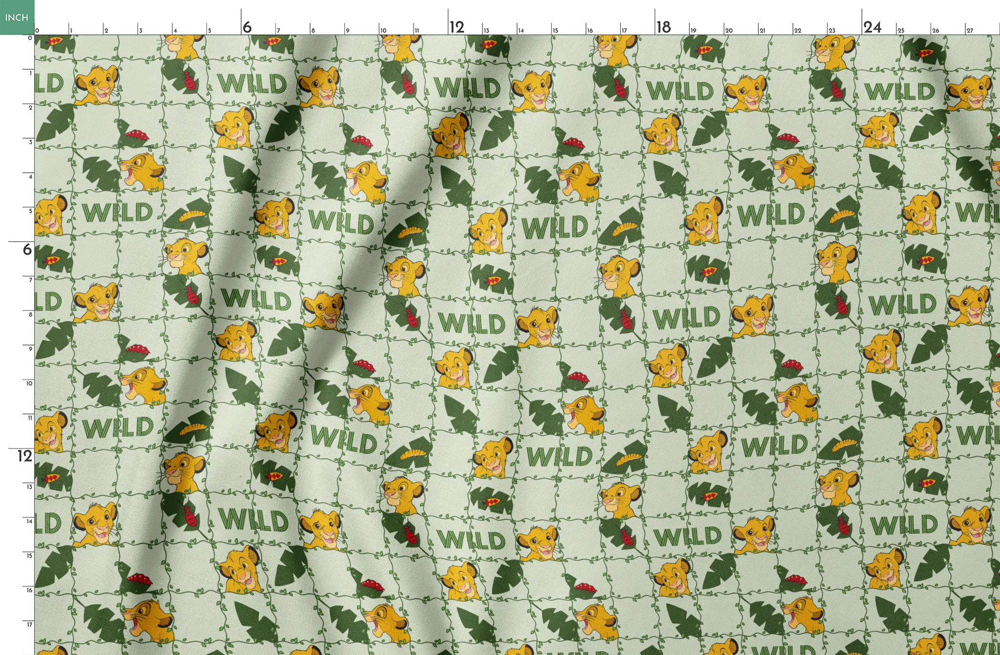 Young cartoon lion cubs with tropical leaves and "WILD" text on light green background pattern springs fatquarter mockup