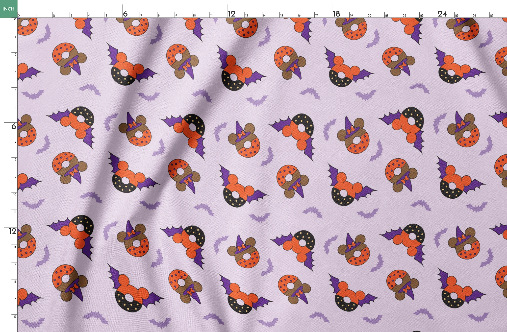 Disney Halloween-themed pattern with orange and black donuts, purple bat wings, and light purple bats on lavender background springs fatquarter mockup