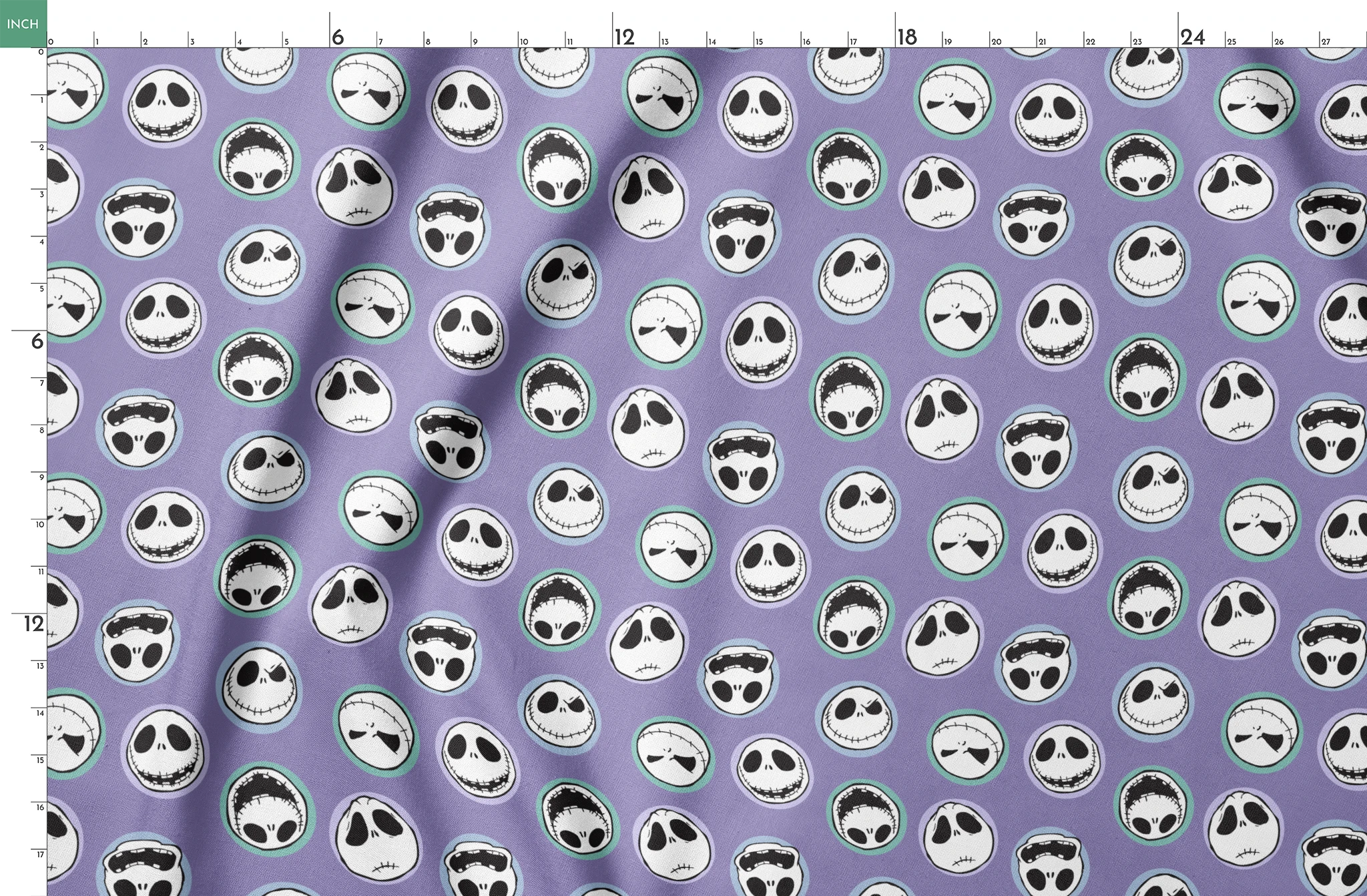 Repeating skull faces with stitched mouths and large eyes on purple background in cartoon style springs fatquarter mockup