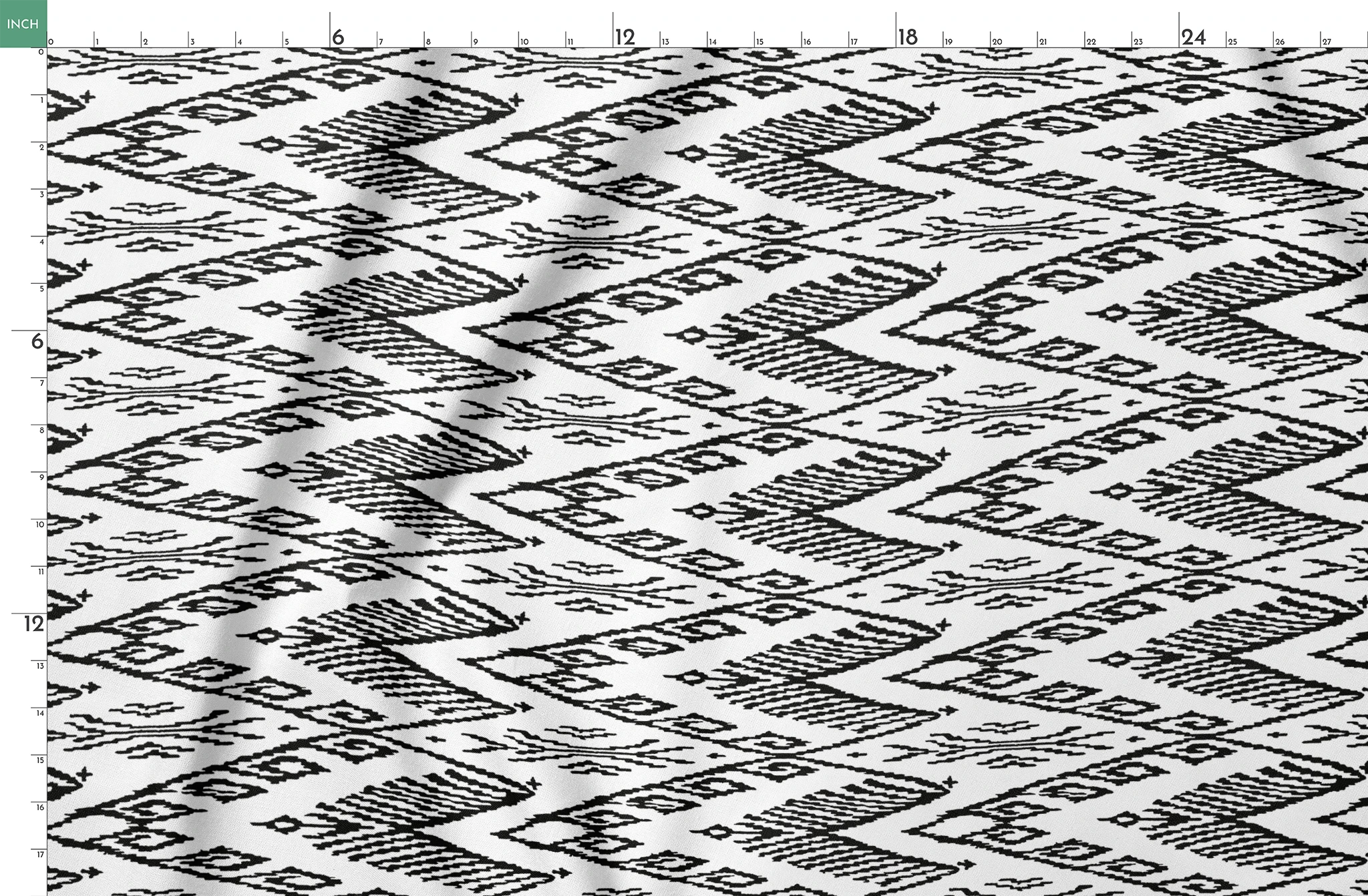 Black and white geometric pattern with diamond shapes and zigzag motifs on a textile surface springs fatquarter mockup