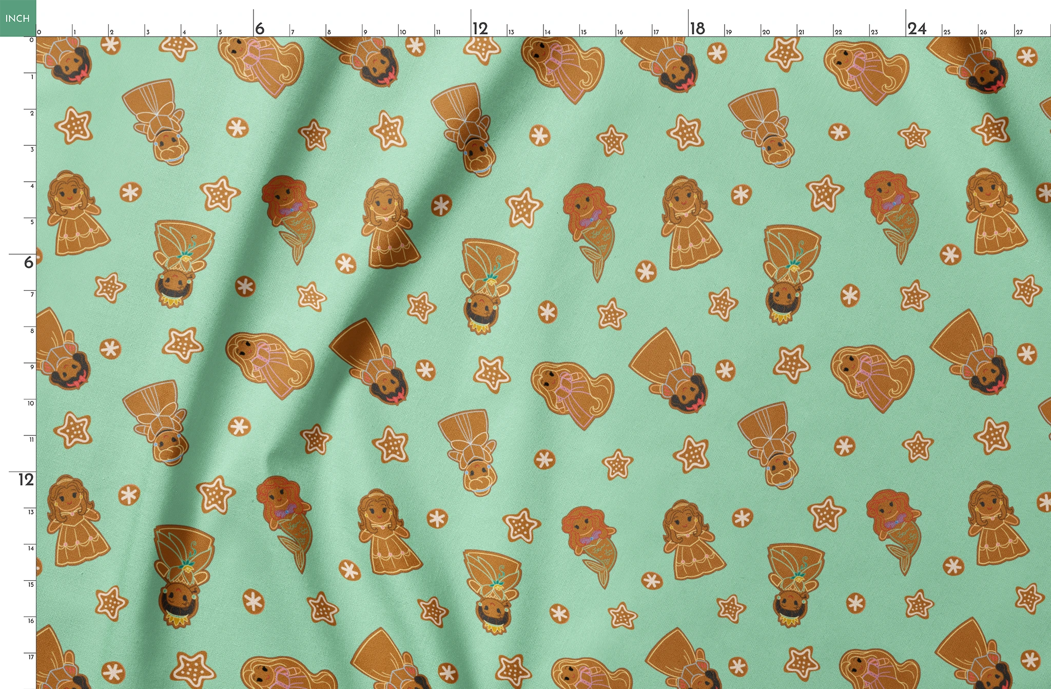 Disney Princess gingerbread cookies with star and snowflake designs on mint green background springs fatquarter mockup