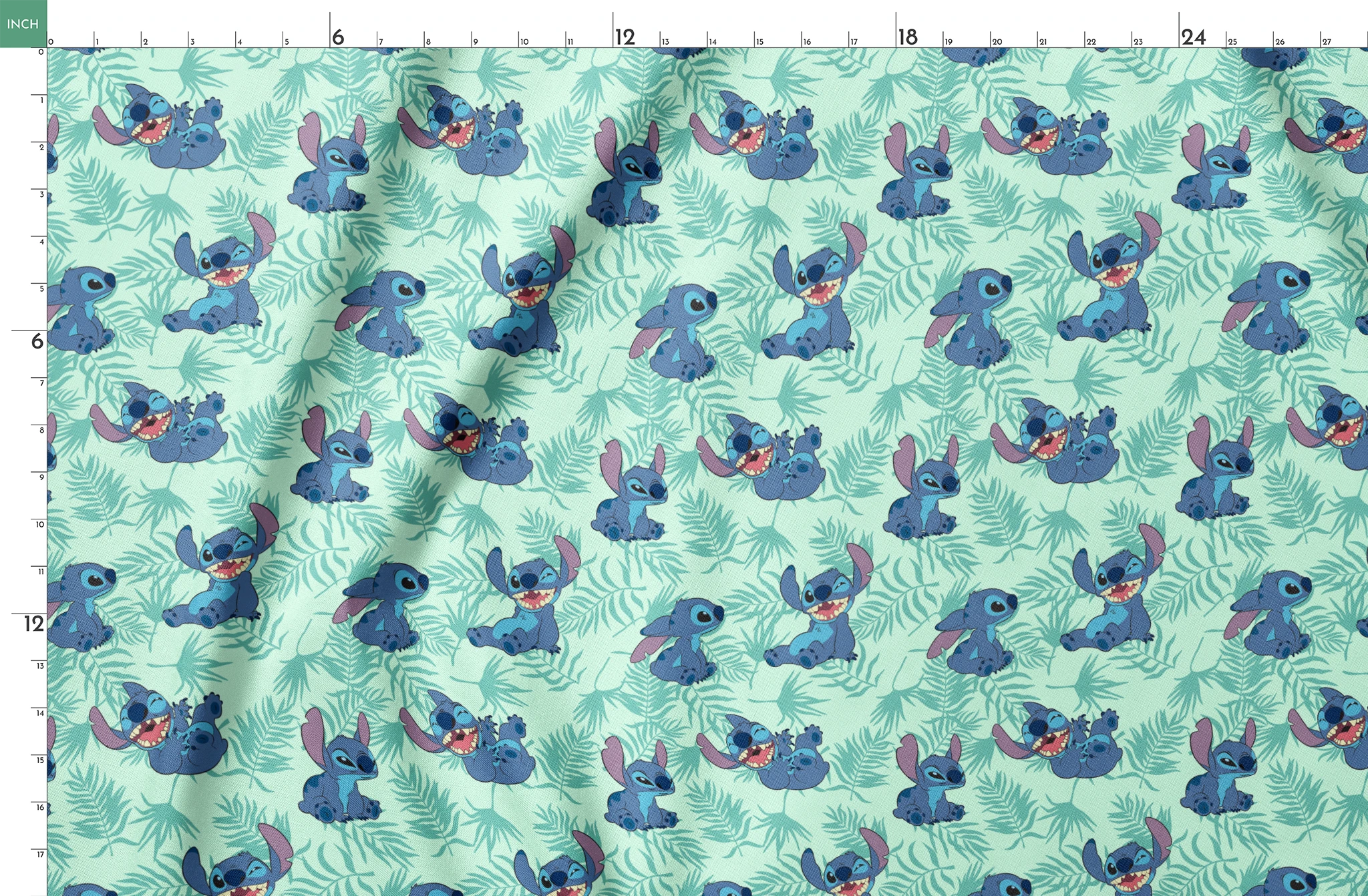 Blue cartoon alien character Stitch in various playful poses against mint green tropical leaf pattern background springs fatquarter mockup