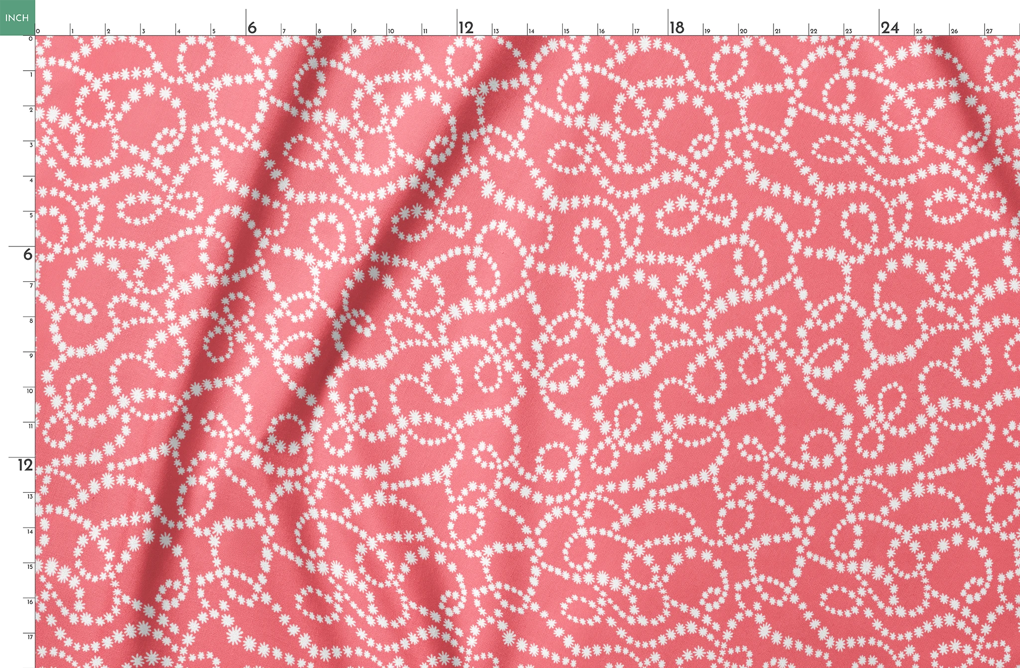 White dot patterns forming swirling chains on coral pink background springs fatquarter mockup