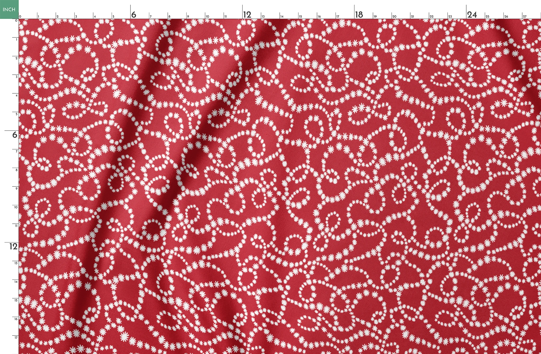 White dotted swirl pattern on rich red background creating decorative curving lines springs fatquarter mockup