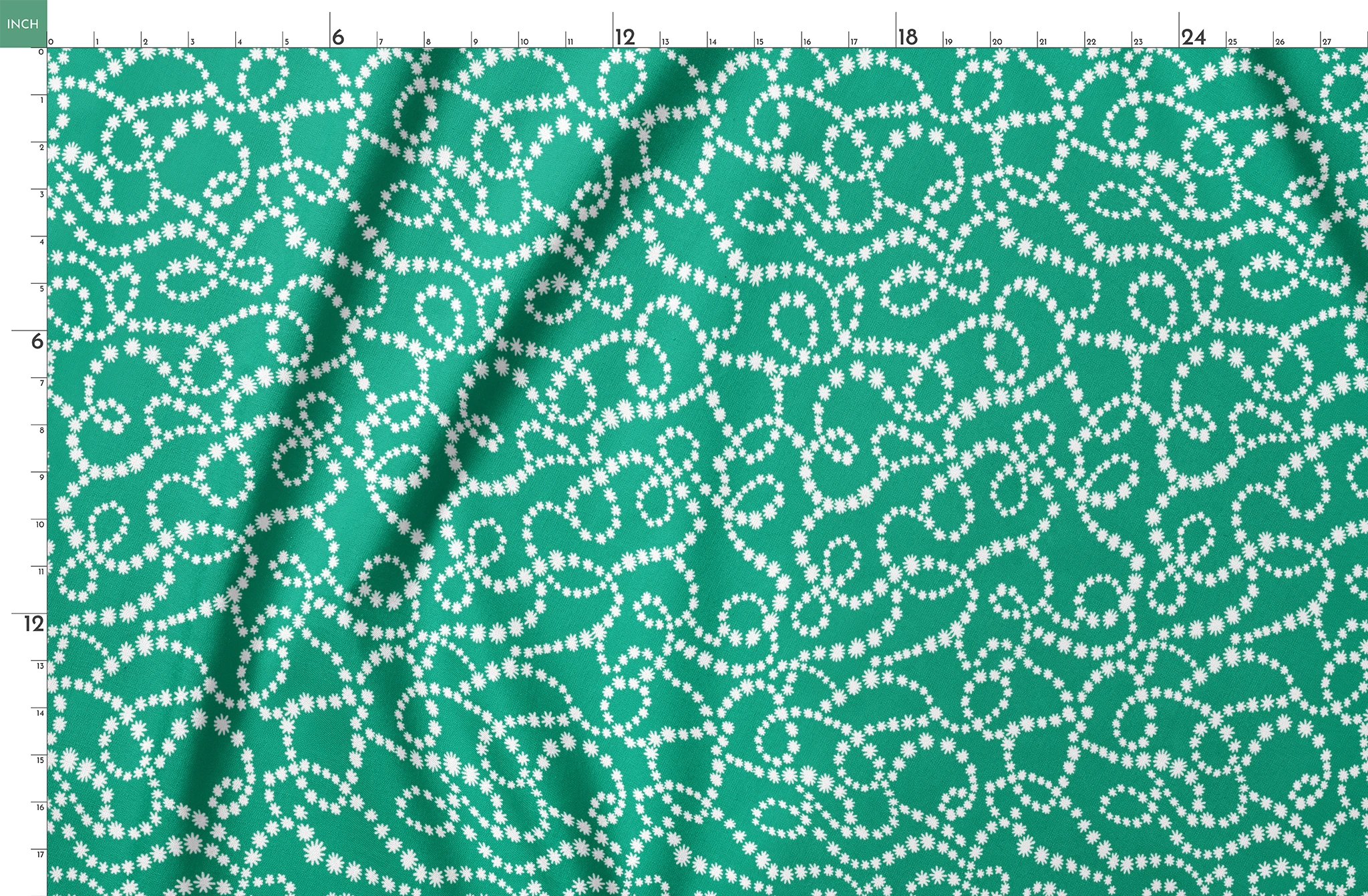 White dotted swirling patterns on green background forming abstract curving lines springs fatquarter mockup