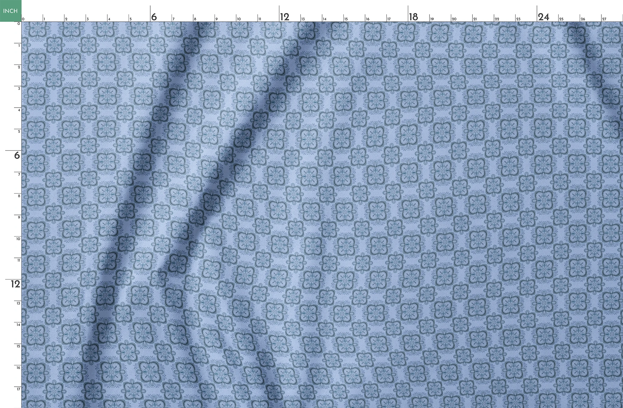 Symmetrical floral mandala pattern in layered blue tones with hand-drawn botanical details, designed by Nicole Tamarin. springs fatquarter mockup