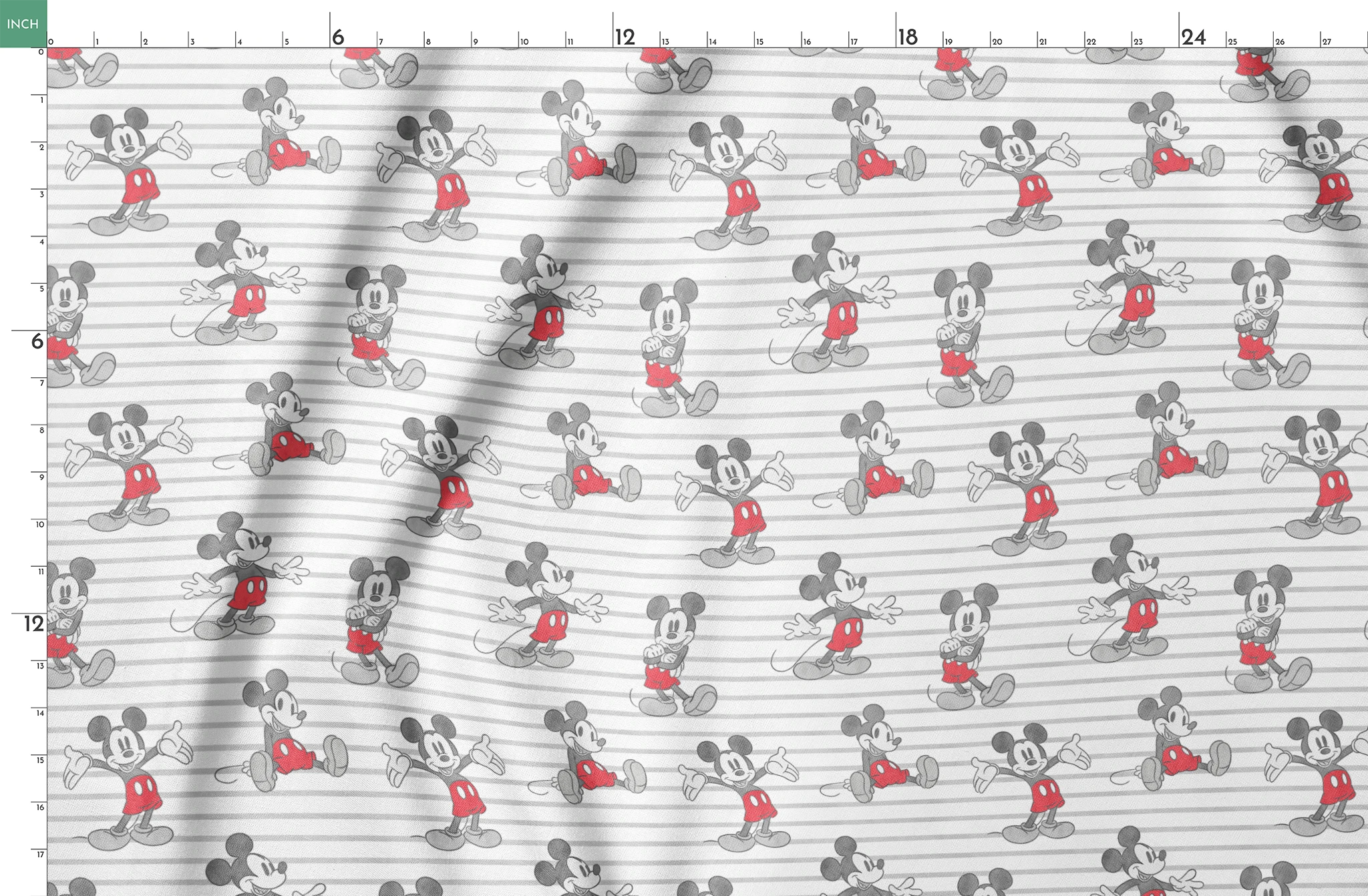 Mickey Mouse cartoon characters in various poses on gray and white striped background springs fatquarter mockup