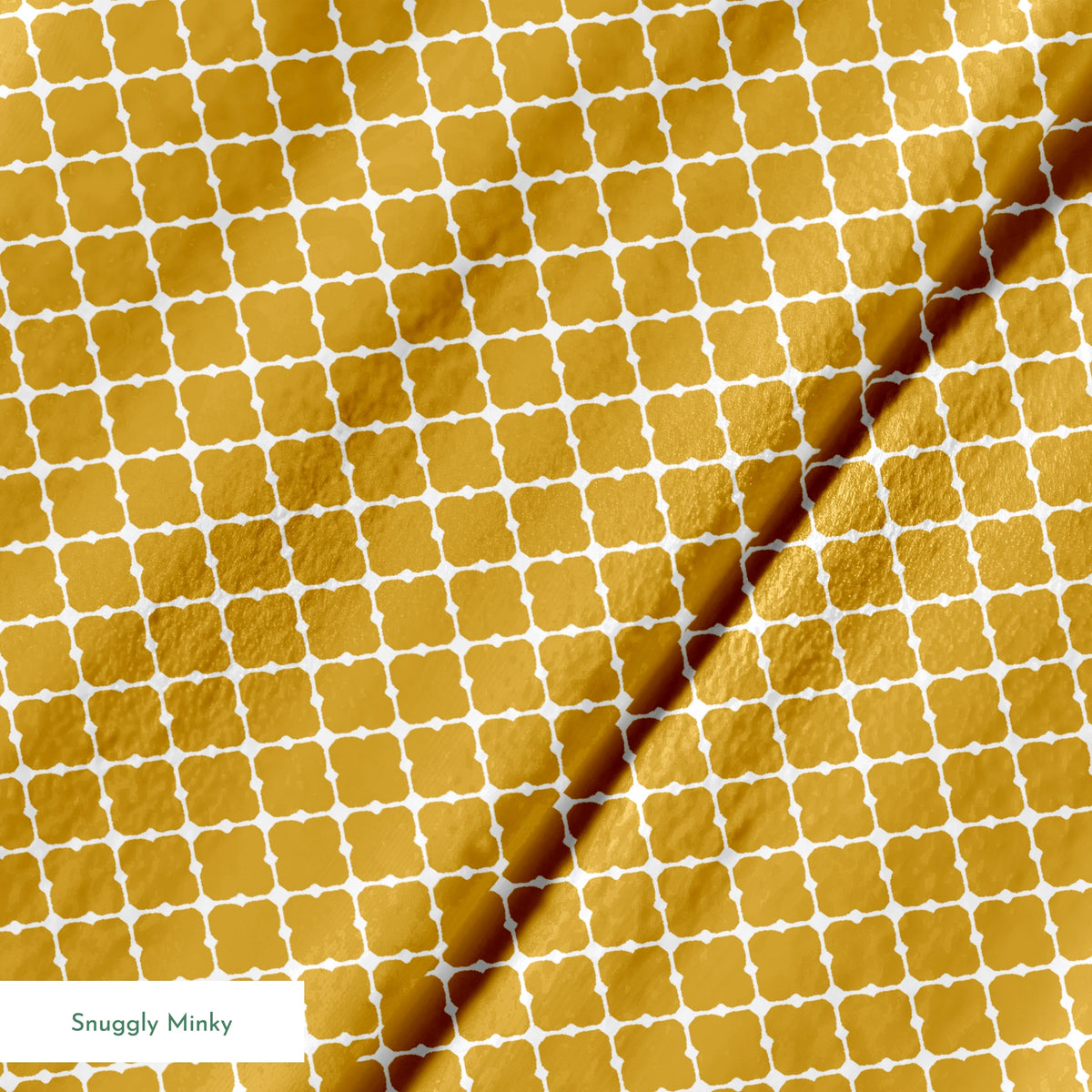 Gold quatrefoil pattern on white background, forming a geometric Moroccan-style lattice design springs minky texture