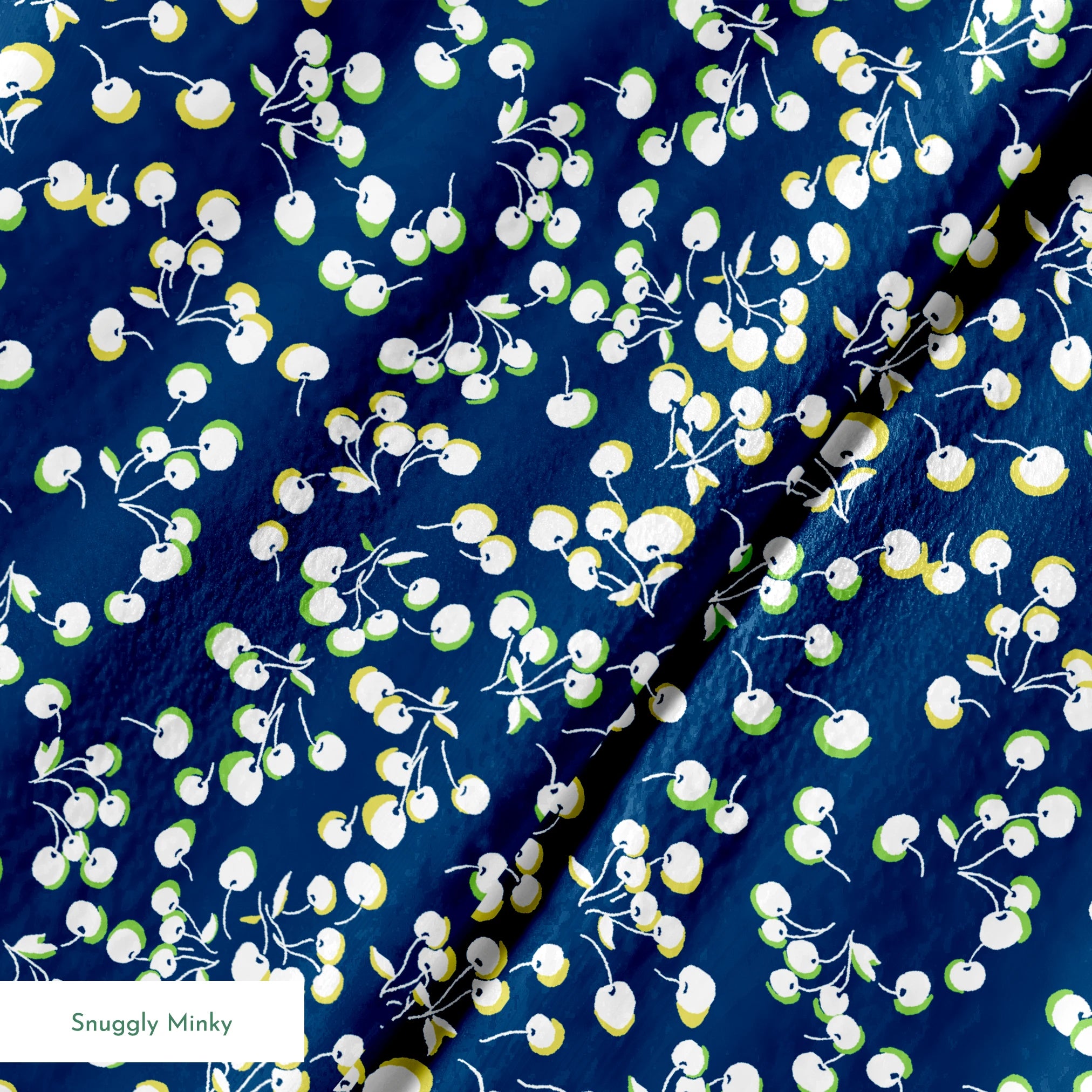 Delicate white and yellow floral pattern scattered across a deep navy blue background springs minky texture