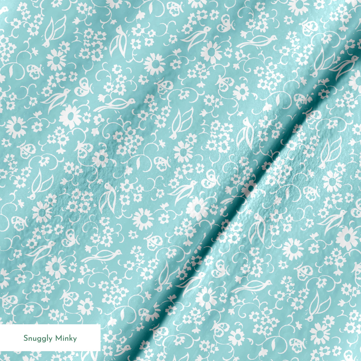 Delicate white floral pattern on a soft turquoise background with swirling leaf motifs springs minky texture