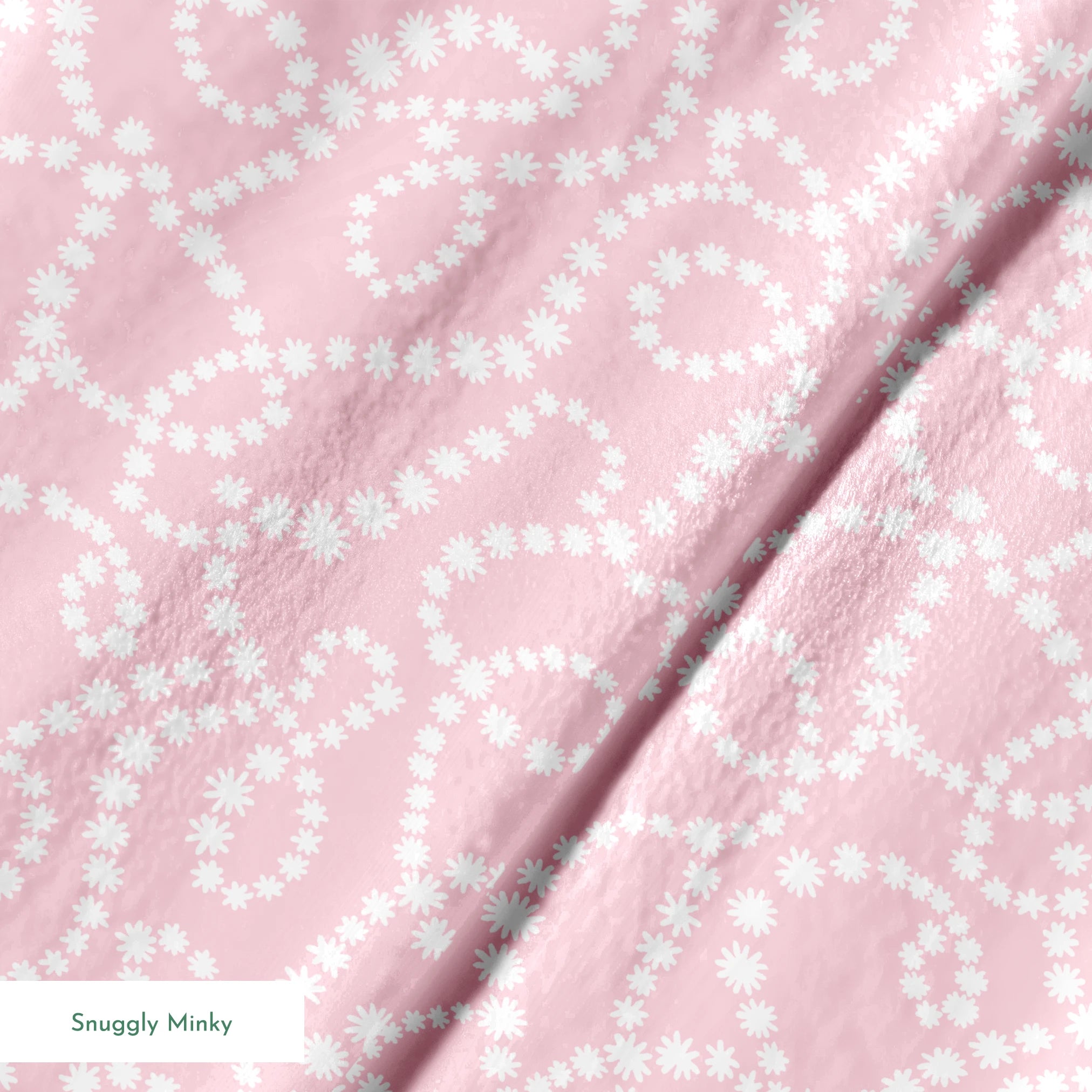Baby pink background with white dotted swirling pattern creating delicate curved lines and loops springs minky texture
