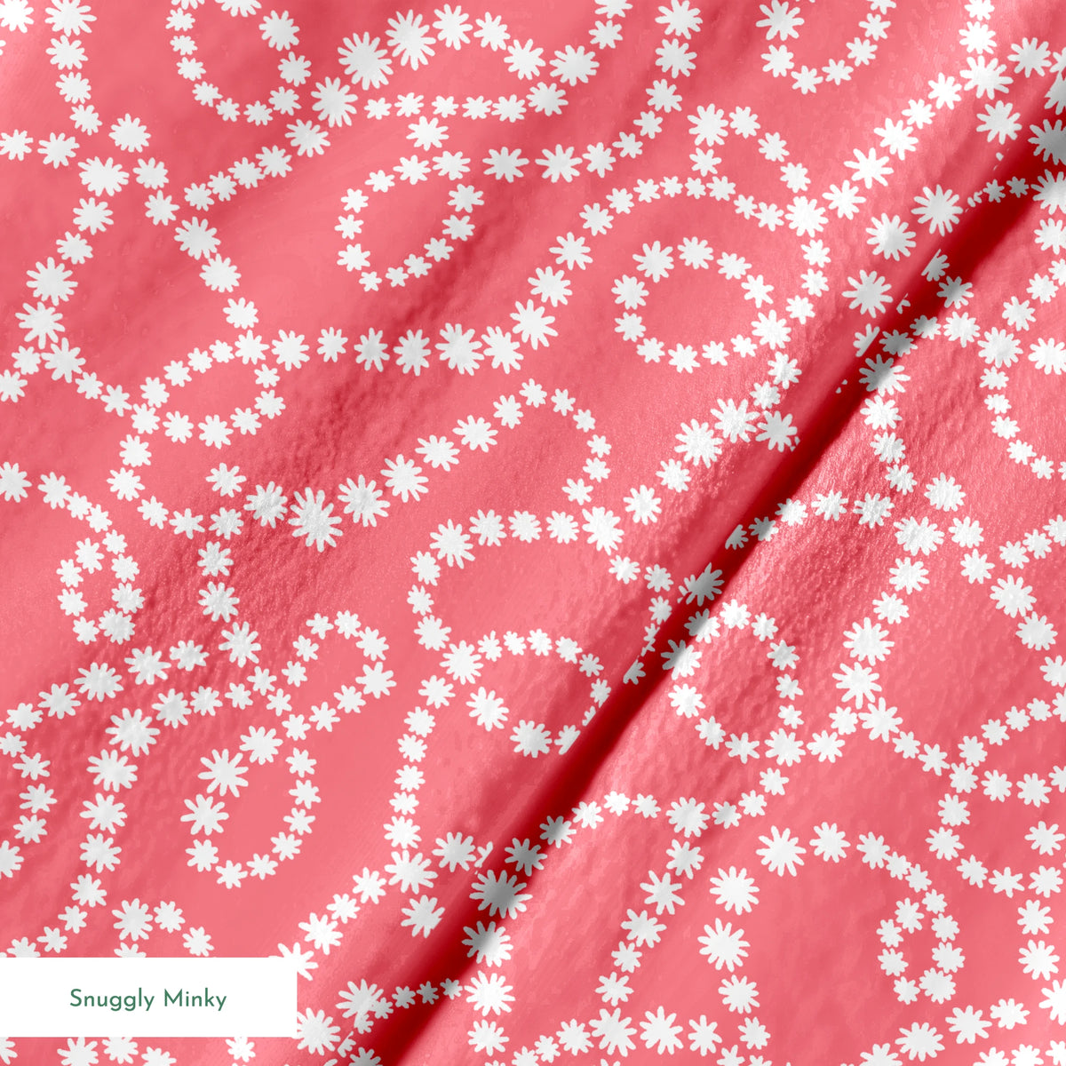 White dot patterns forming swirling chains on coral pink background springs minky texture