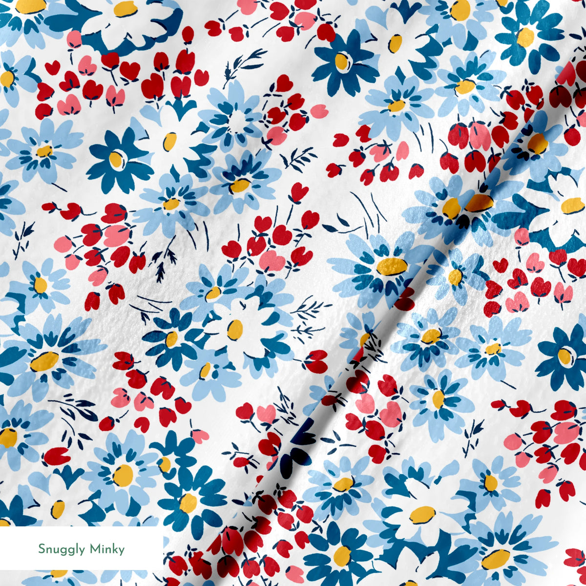 Blue and white daisies with small red berries scattered across a light background in a floral pattern springs minky texture