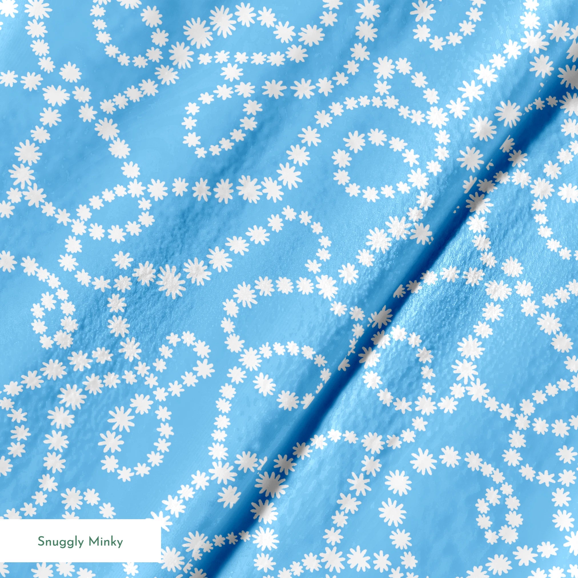 Sky blue background with swirling white dotted pattern resembling beaded strings or pearls arranged in curving lines springs minky texture