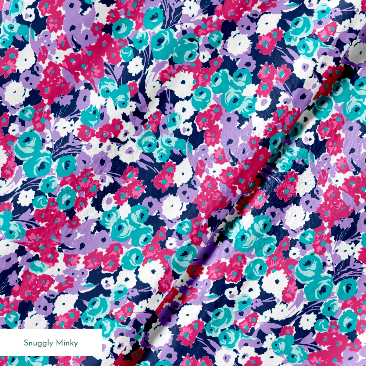 Vibrant floral pattern with pink, white, purple, and turquoise flowers on dark indigo background springs minky texture