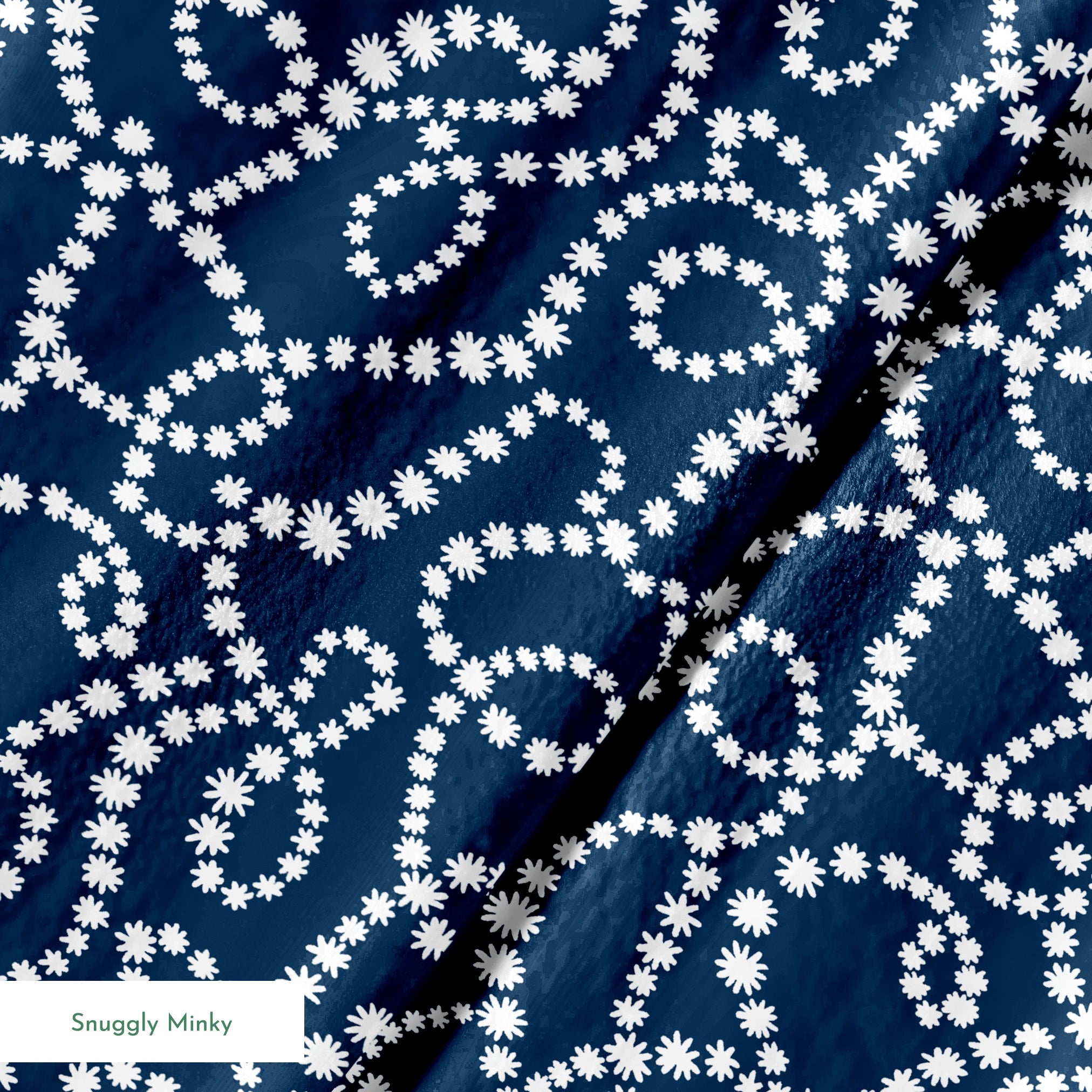 Navy blue background with swirling white dotted patterns creating circular and flowing designs springs minky texture