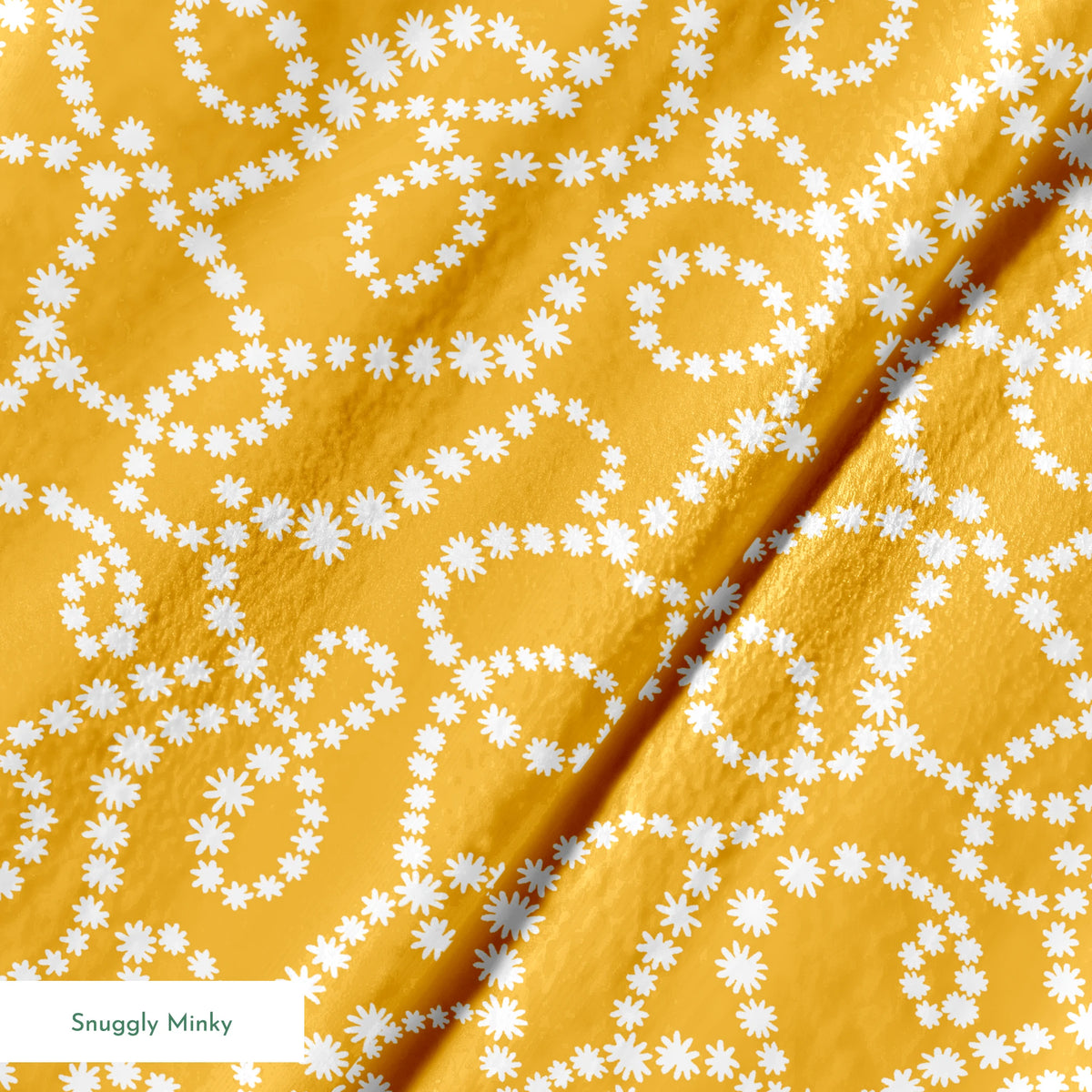 Mustard yellow background with swirling dotted white patterns forming organic circular designs springs minky texture