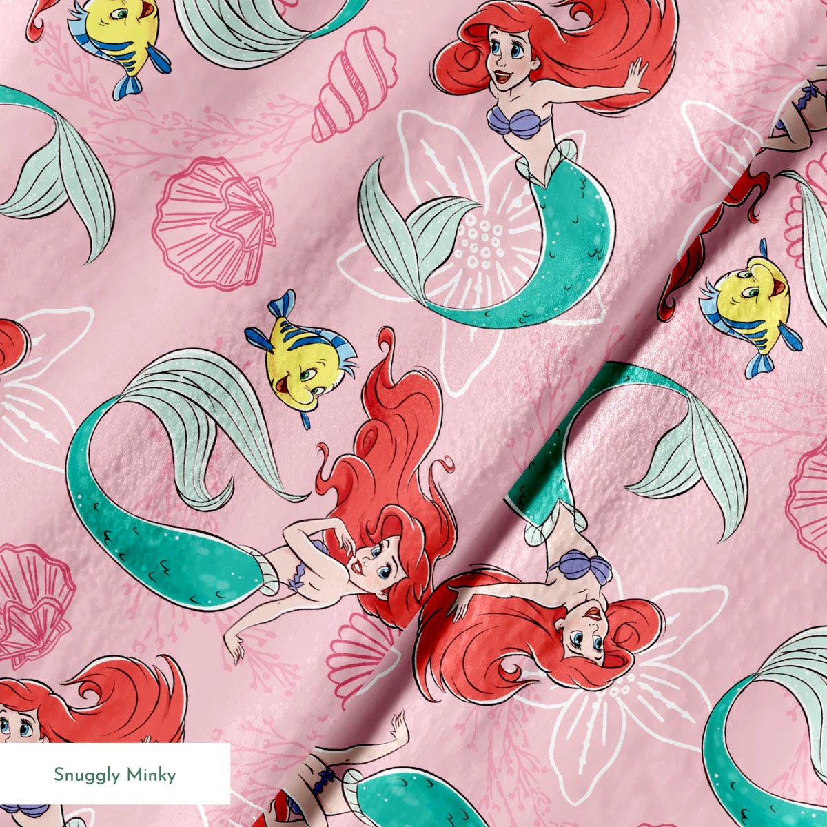 Illustrated pattern of mermaids with red hair and green tails swimming with yellow fish on pink seashell background springs minky texture