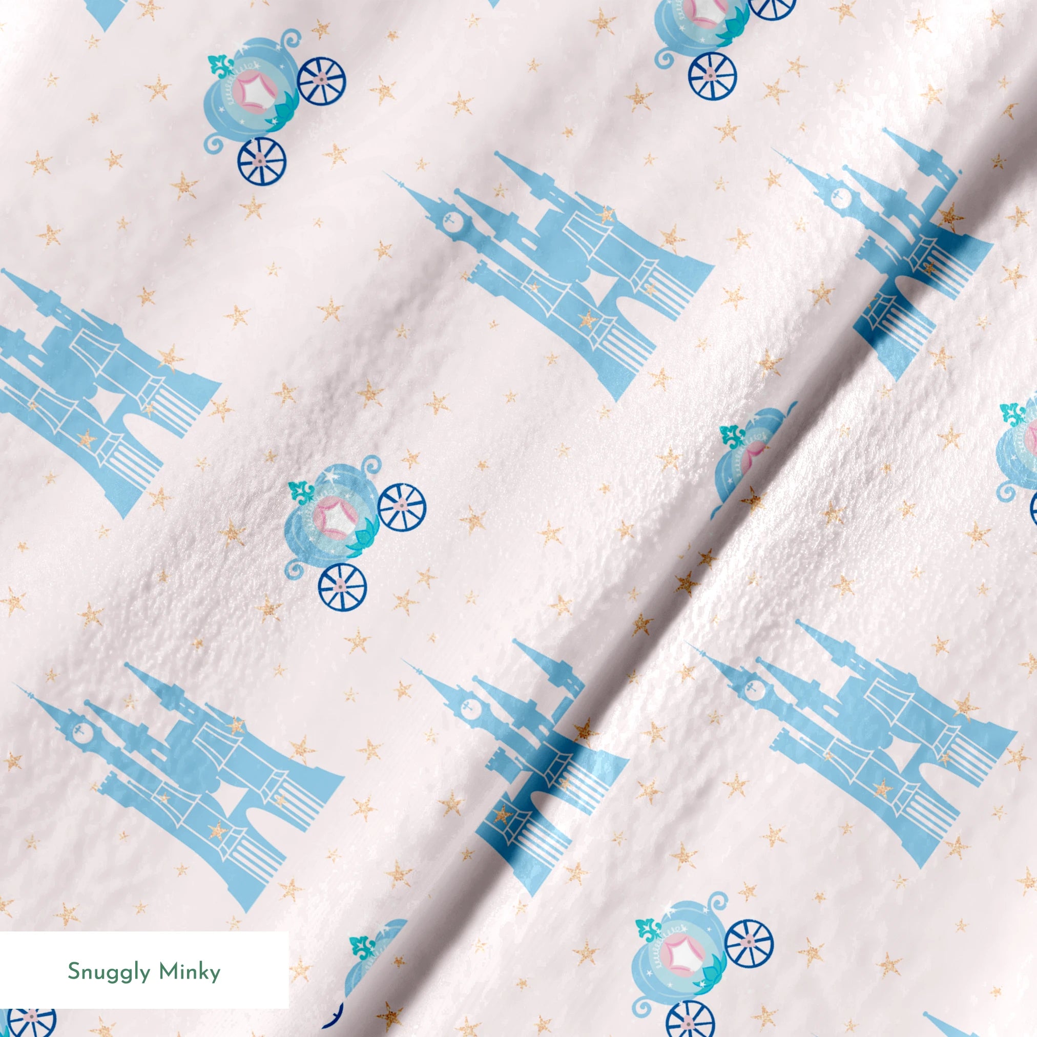 Cinderella pattern with blue castles, carriages, and gold stars on pale pink background springs minky texture