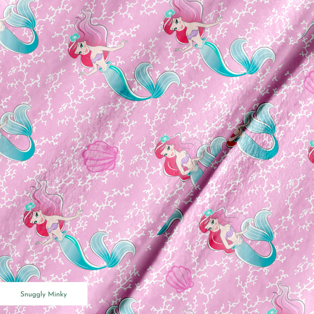 The Little Mermaid pattern with Ariel and purple seashells on pink background with white bubbles springs minky texture